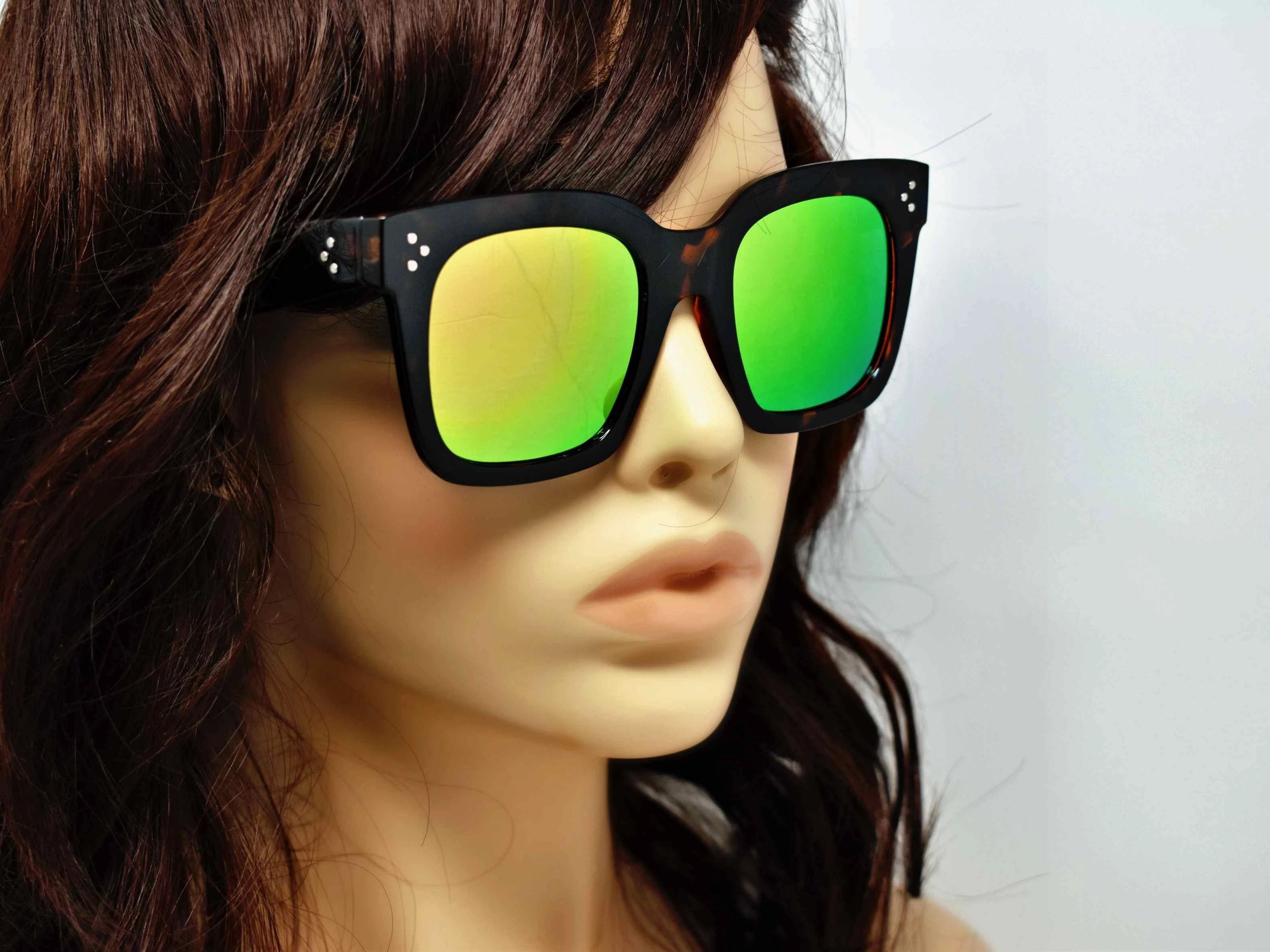 Cool and Classic you can always depend on our Amaranth Leopard framed sunglasses with a green and hint of rust mirrored lens in a wayfarer shape.