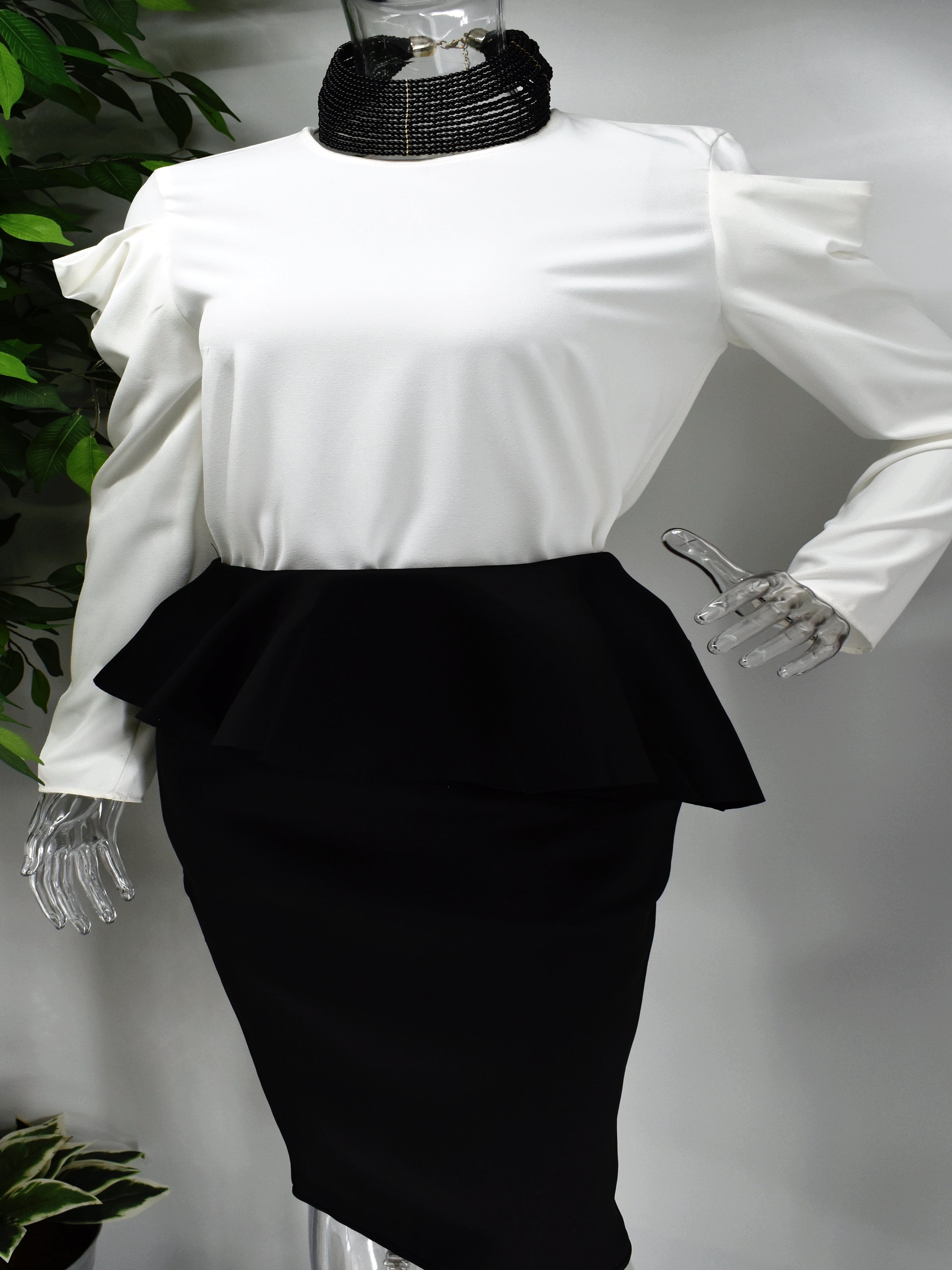 Enhance your wardrobe and choose our Bamby white long sleeve blouse. Bamby is a long sleeve white blouse with an irregular designed sleeve. Defiantly a statement piece and a must have.  
