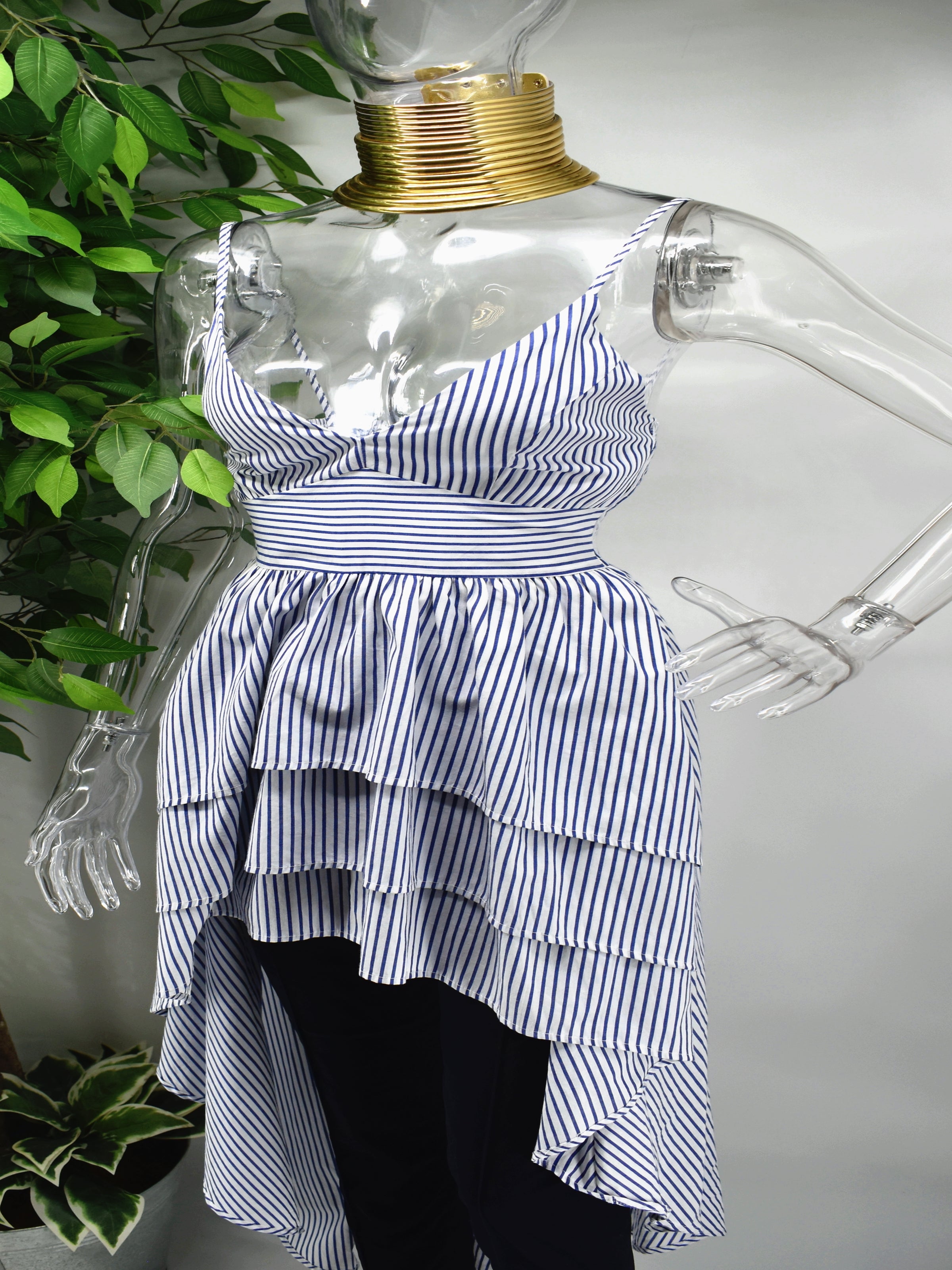 You wont regret taking a chance on our Barbette Stripe Top.  Our Barbette blue and white stripe top is a beauty for most occasions. It has a sweetheart neckline accompanied by spagetti straps which falls into a peplum tiered hemline. 