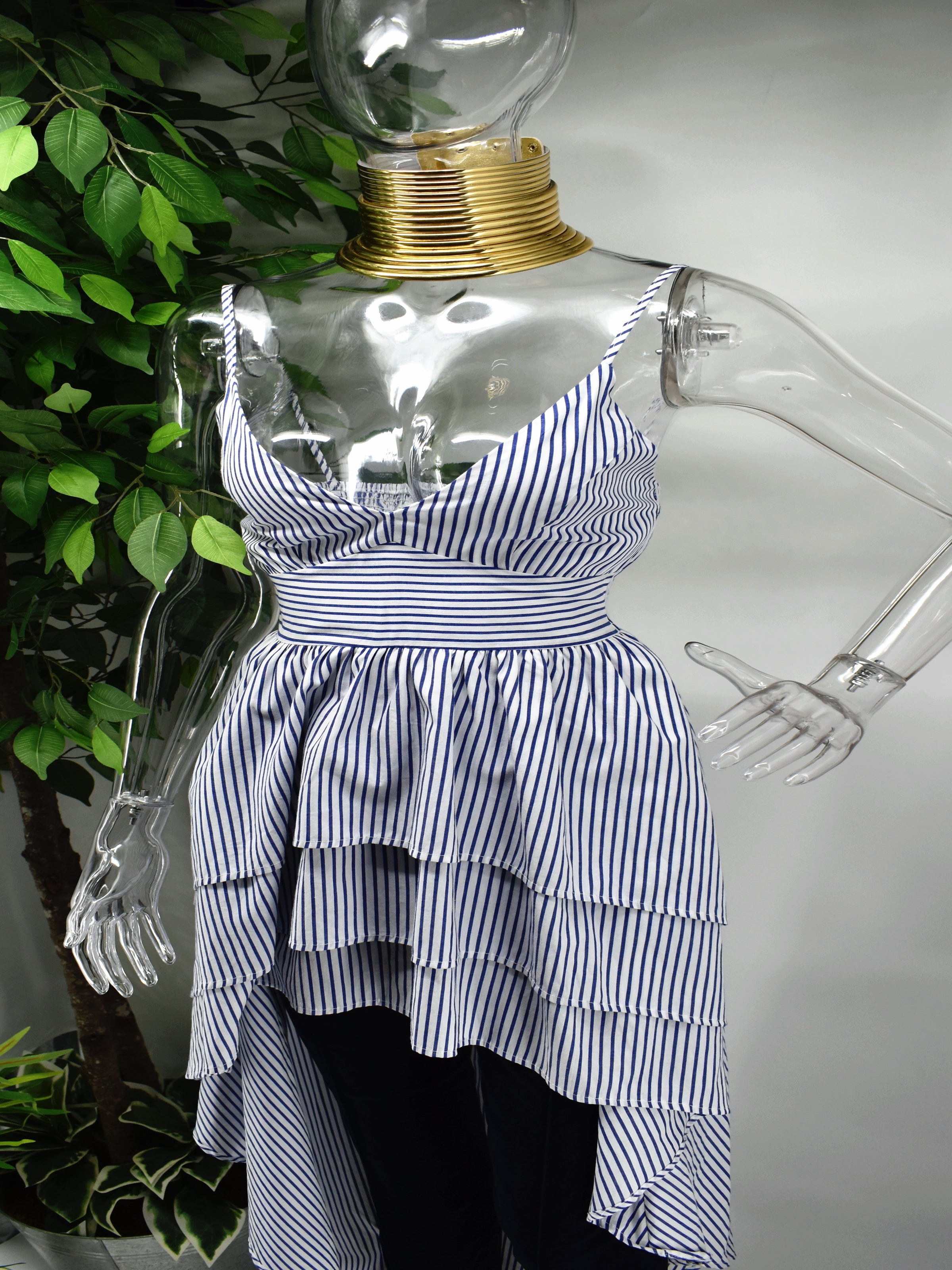 You wont regret taking a chance on our Barbette Stripe Top.  Our Barbette blue and white stripe top is a beauty for most occasions. It has a sweetheart neckline accompanied by spagetti straps which falls into a peplum tiered hemline. 