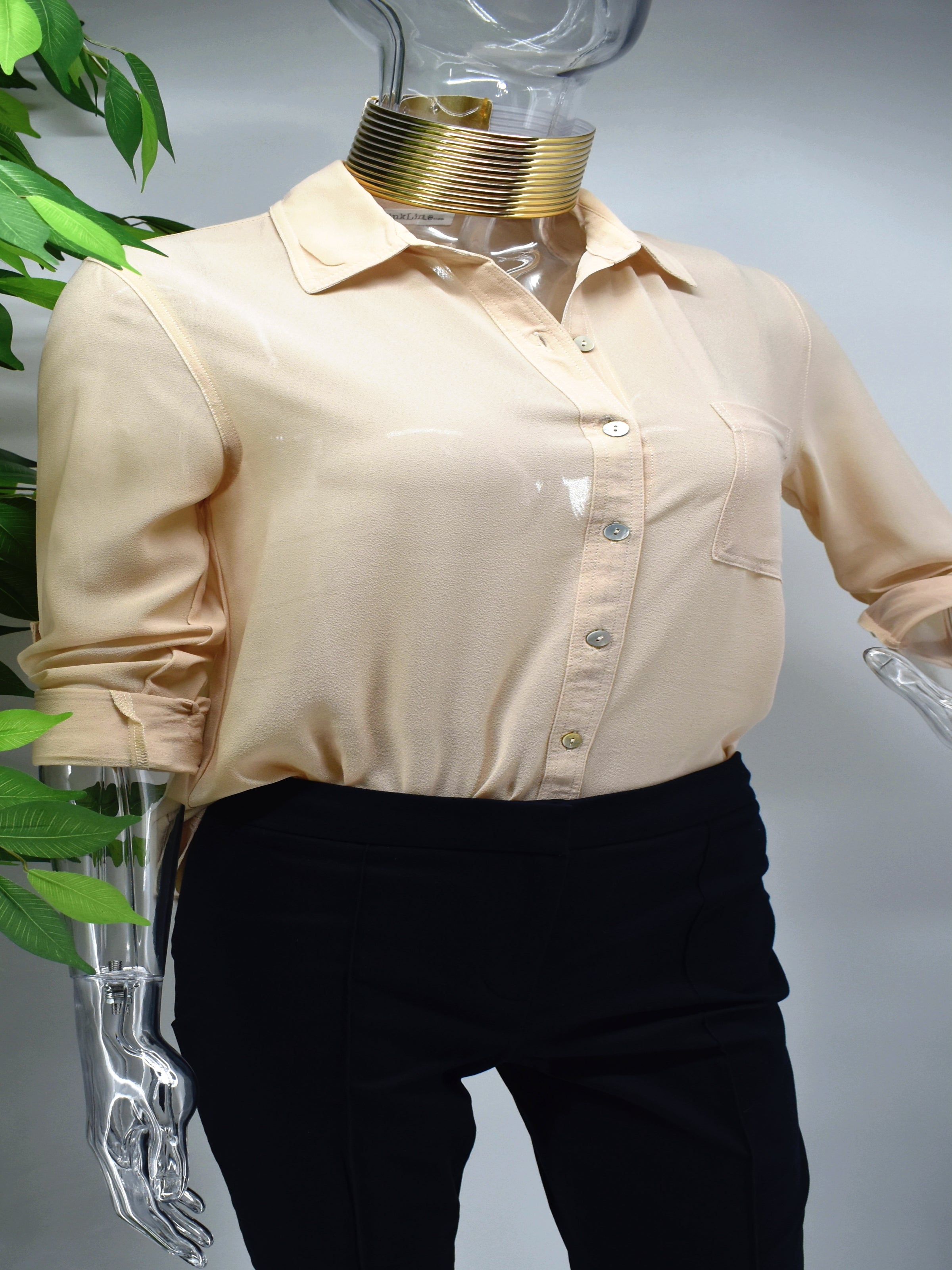 Enjoy an elegant design that never fades with our classic Bayla shirt blouse. Our Bayla is a beige button front shirt blouse loose in fit with a classic rolled cuffed sleeve. 