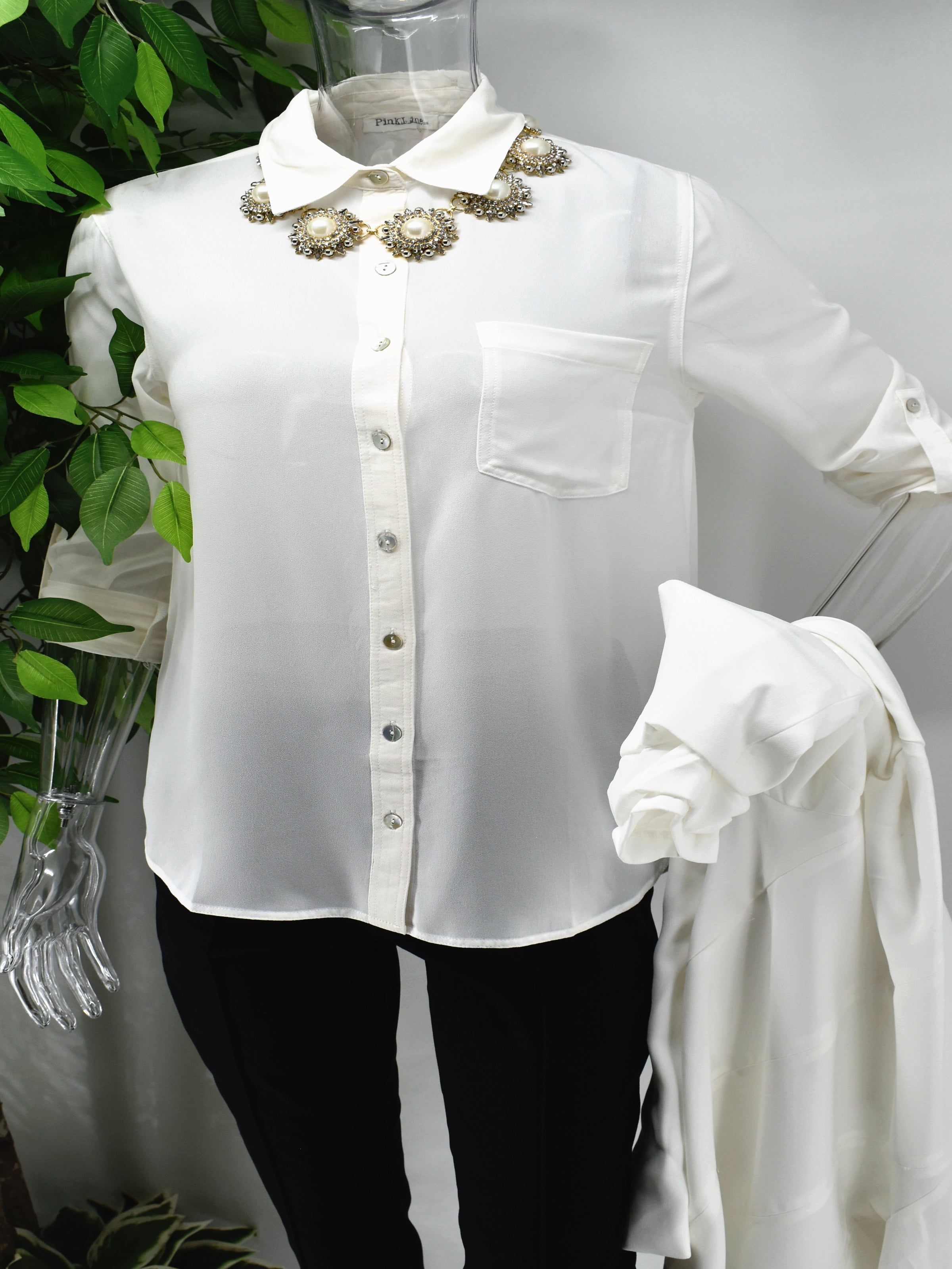 Enjoy an elegant design that never fades with our classic Bayla shirt blouse. Our Bayla is a white button front shirt blouse loose in fit with a classic rolled cuffed sleeve. 