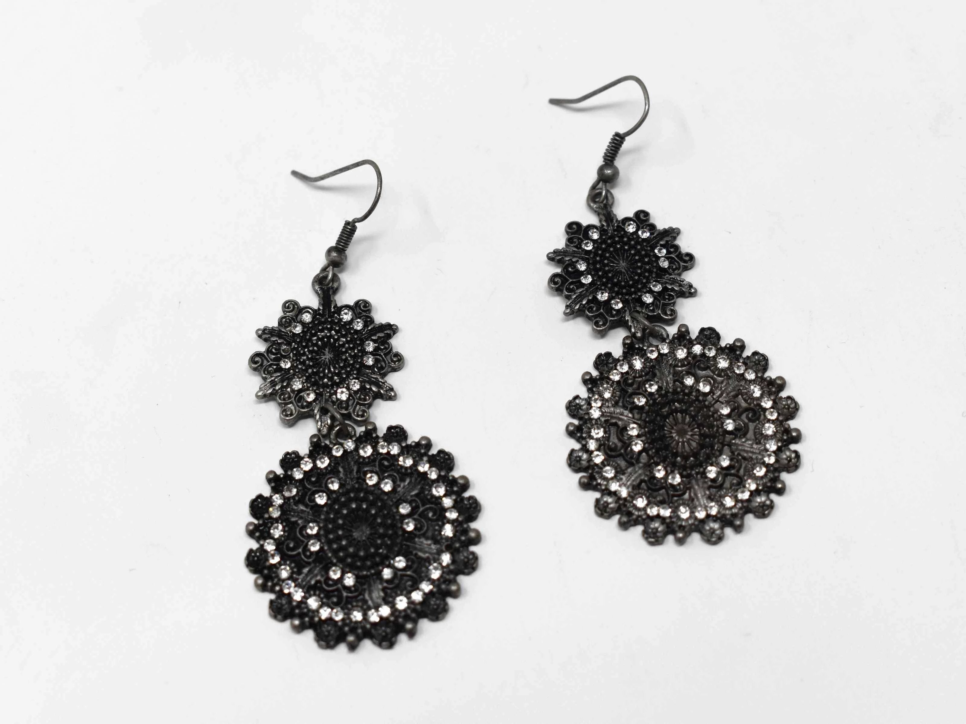 Our attention getting  Begonia dark silver earrings is an antique styled dangle earring with stones. It measures 2 1/2" in length and has a fishhook clasp.