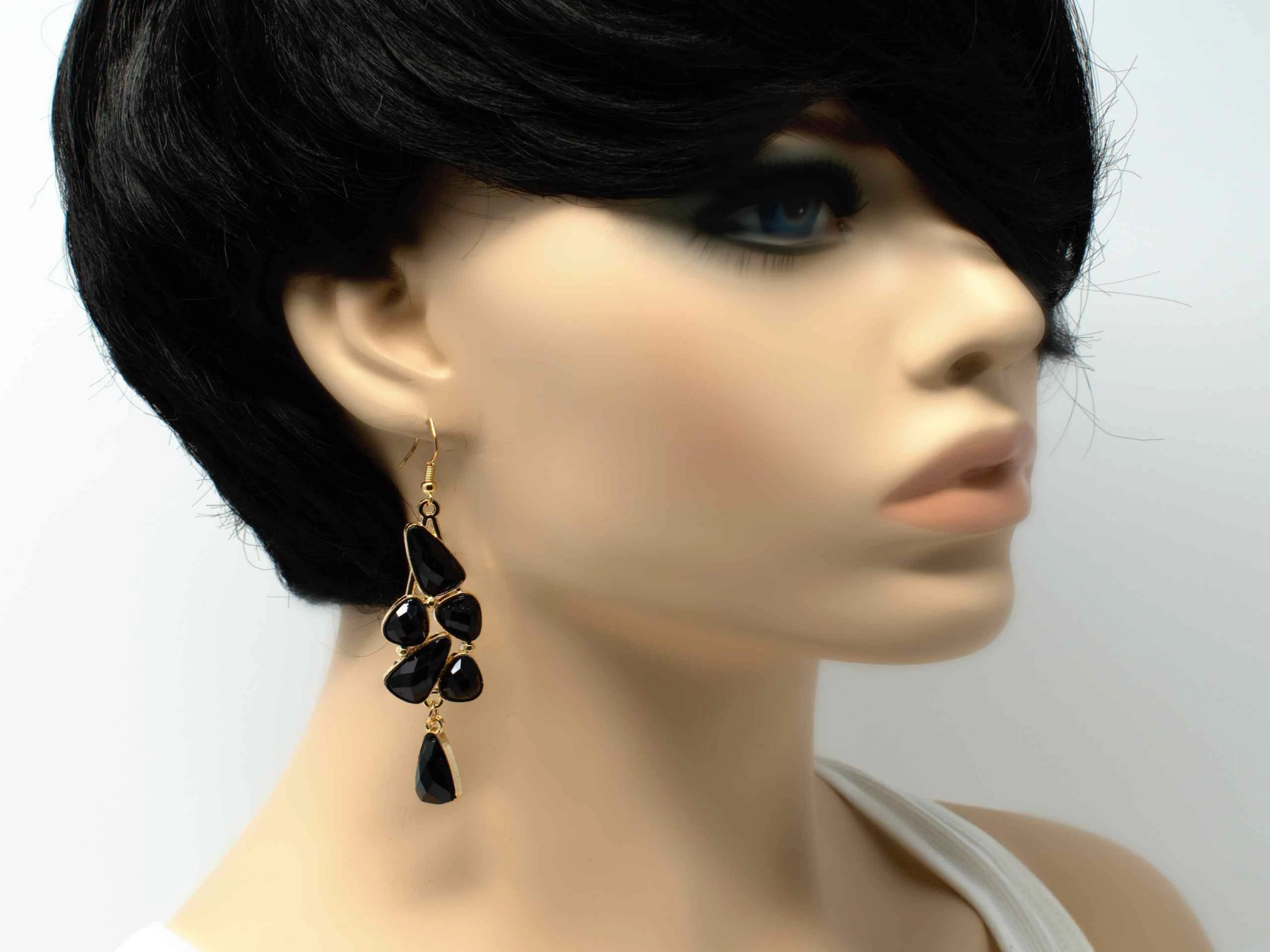 An elegant outstanding gold with black accent stones fashion dangle drop earring. Comes with a fish hook clasp.
