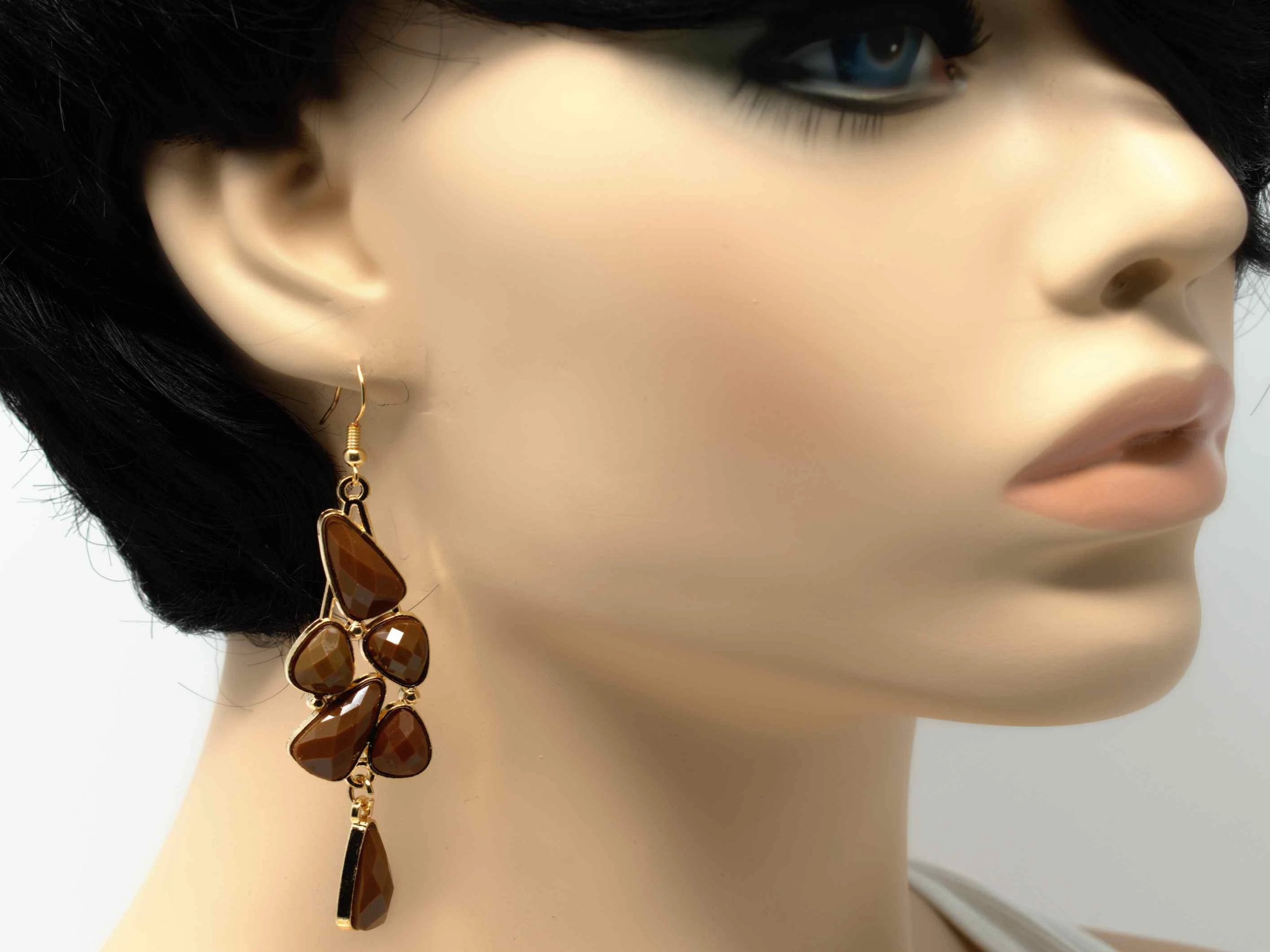 An elegant outstanding gold with brown accent stones fashion dangle drop earring. Comes with a fish hook clasp.