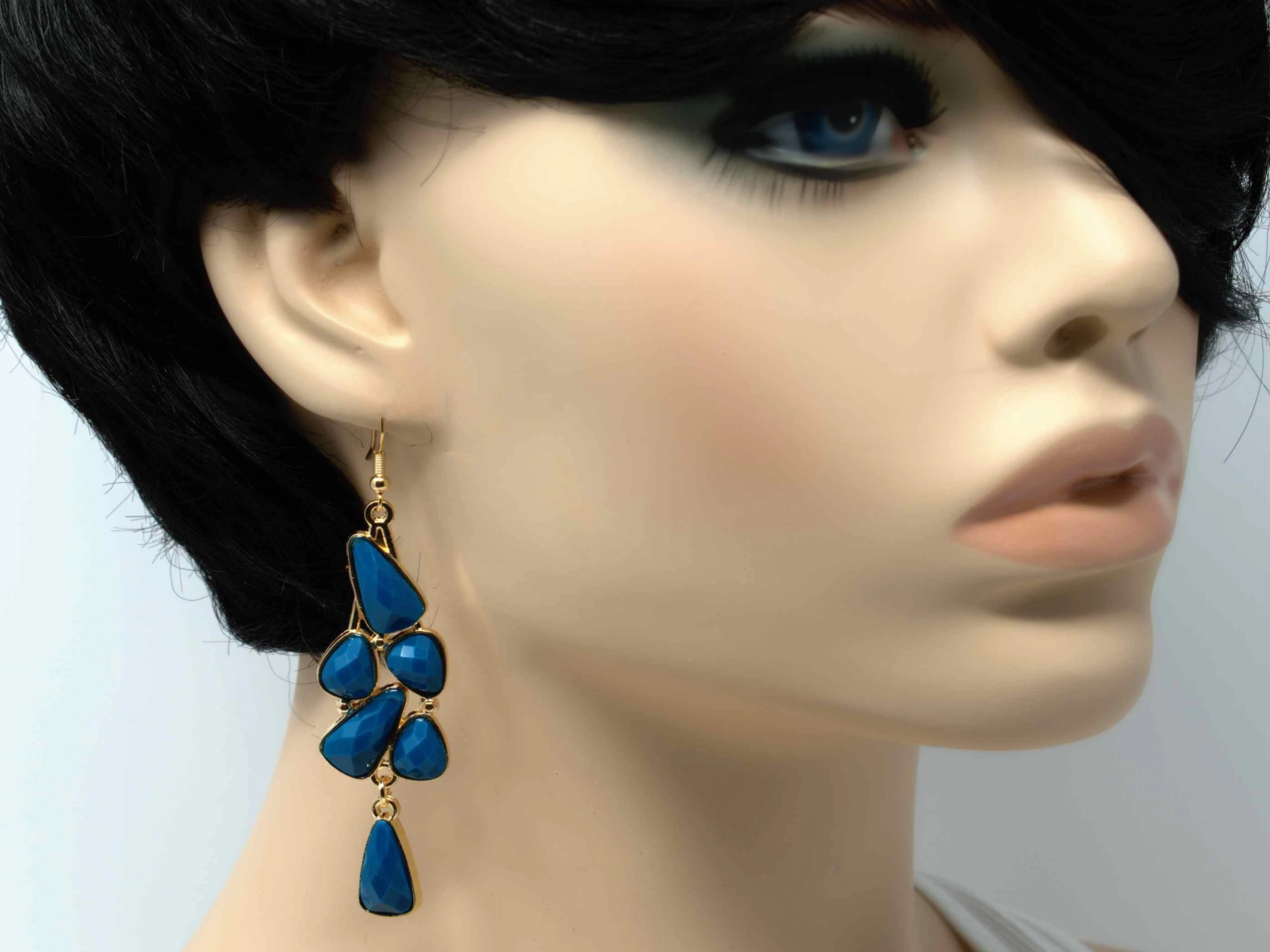 An elegant outstanding gold with turquoise accent stones fashion dangle drop earring. Comes with a fish hook clasp.
