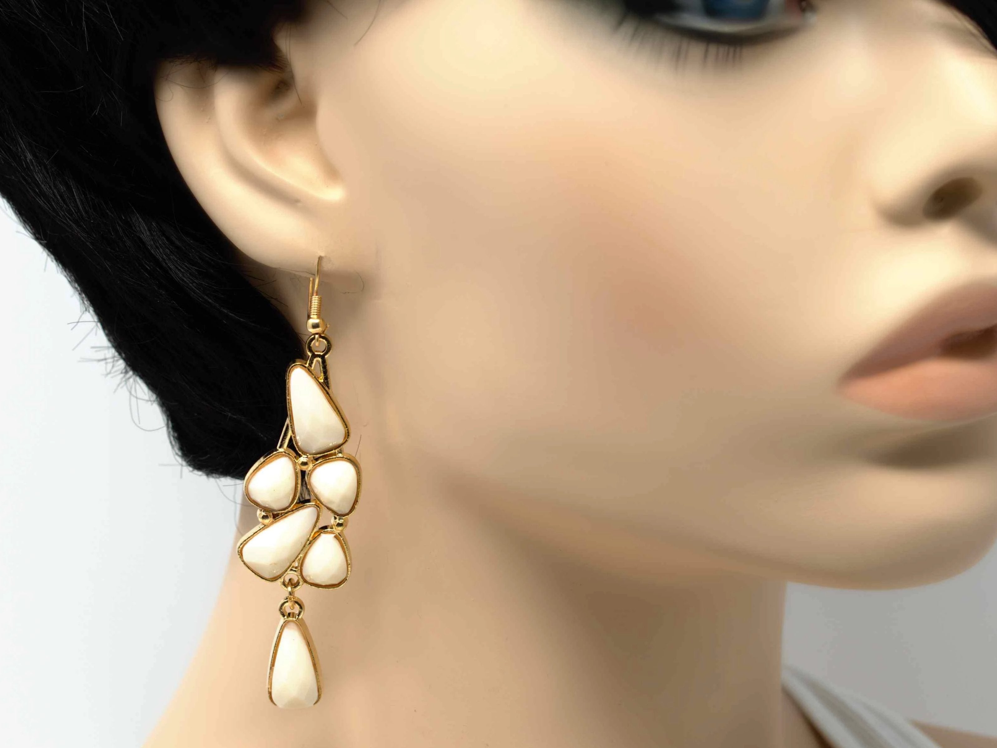 An elegant outstanding gold with white accent stones fashion dangle drop earring. Comes with a fish hook clasp.