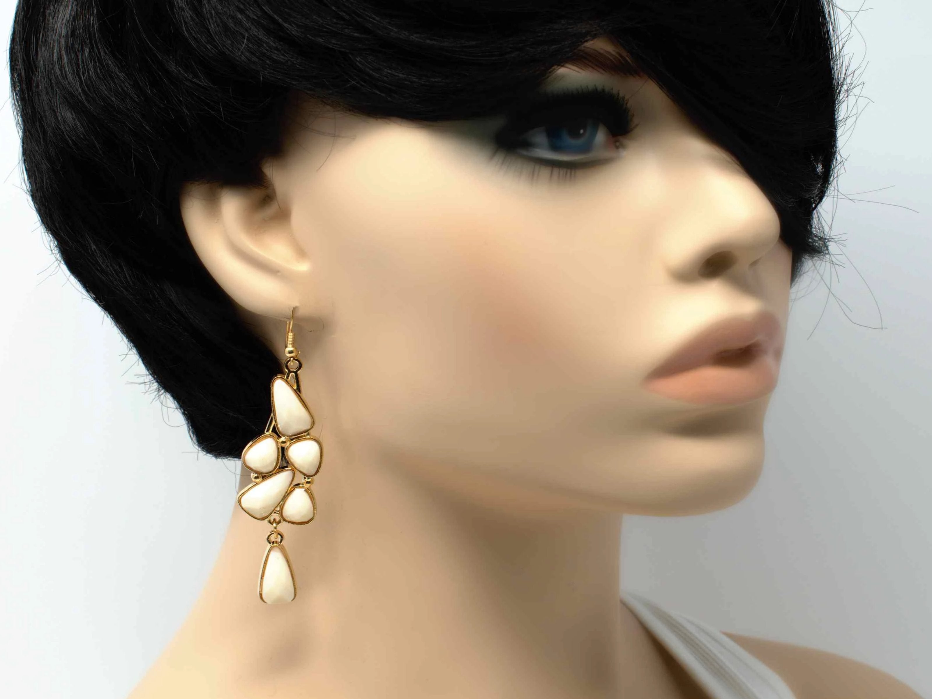 An elegant outstanding gold with white accent stones fashion dangle drop earring. Comes with a fish hook clasp.