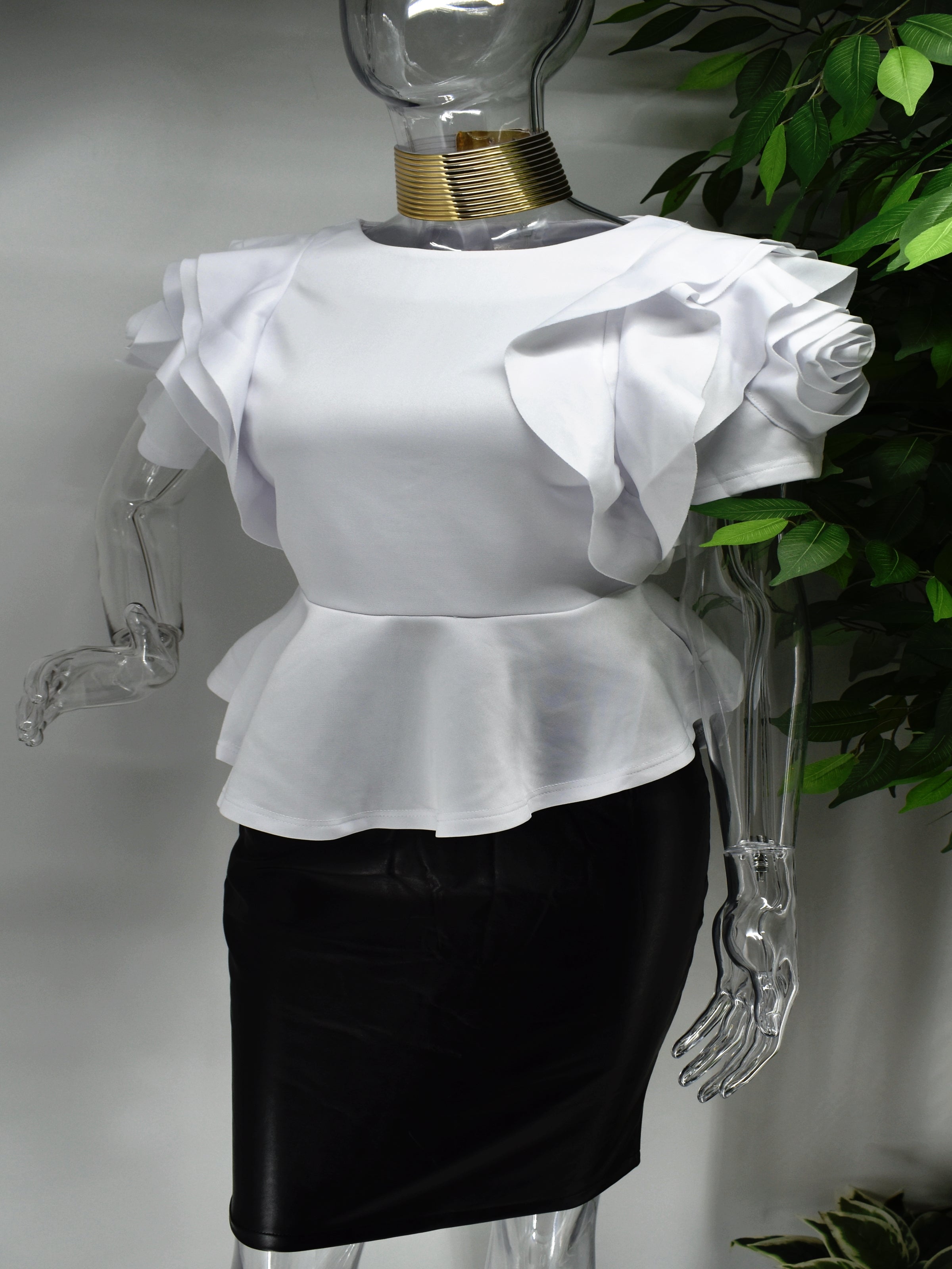 Both classy and fabulous is what they will say when you strut through in our Belladonna white peplum top. Beautifully crafted our belladonna has an intriguing rose design on its sleeve and a  peplum waistline.  White Peplum style Rose design