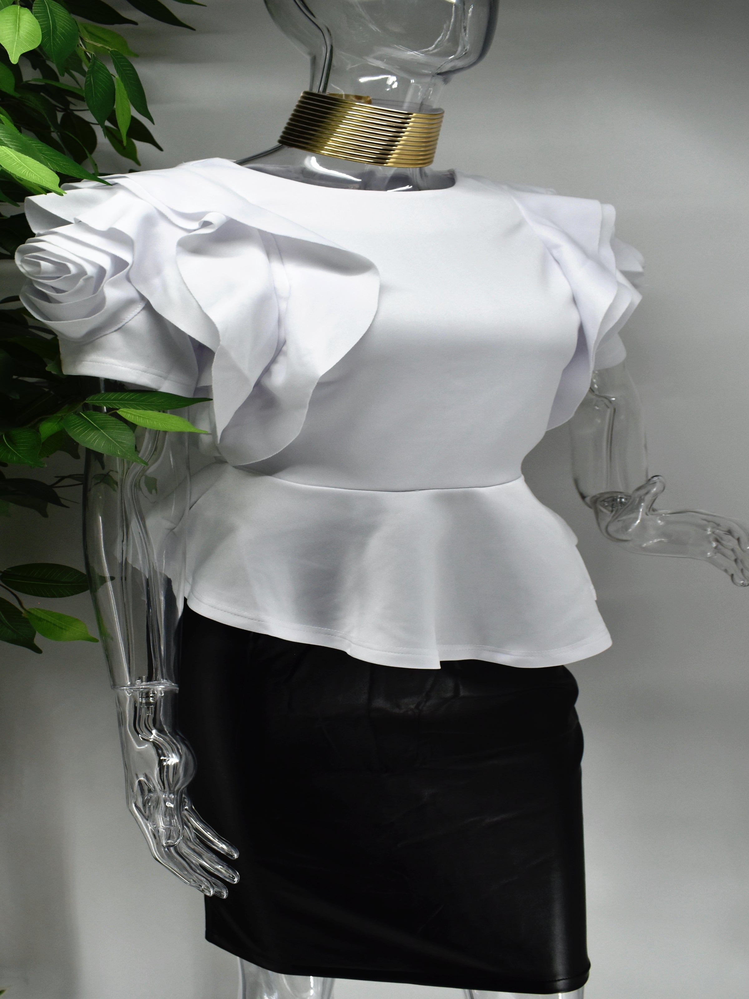 Both classy and fabulous is what they will say when you strut through in our Belladonna white peplum top. Beautifully crafted our belladonna has an intriguing rose design on its sleeve and a  peplum waistline.  White Peplum style Rose design