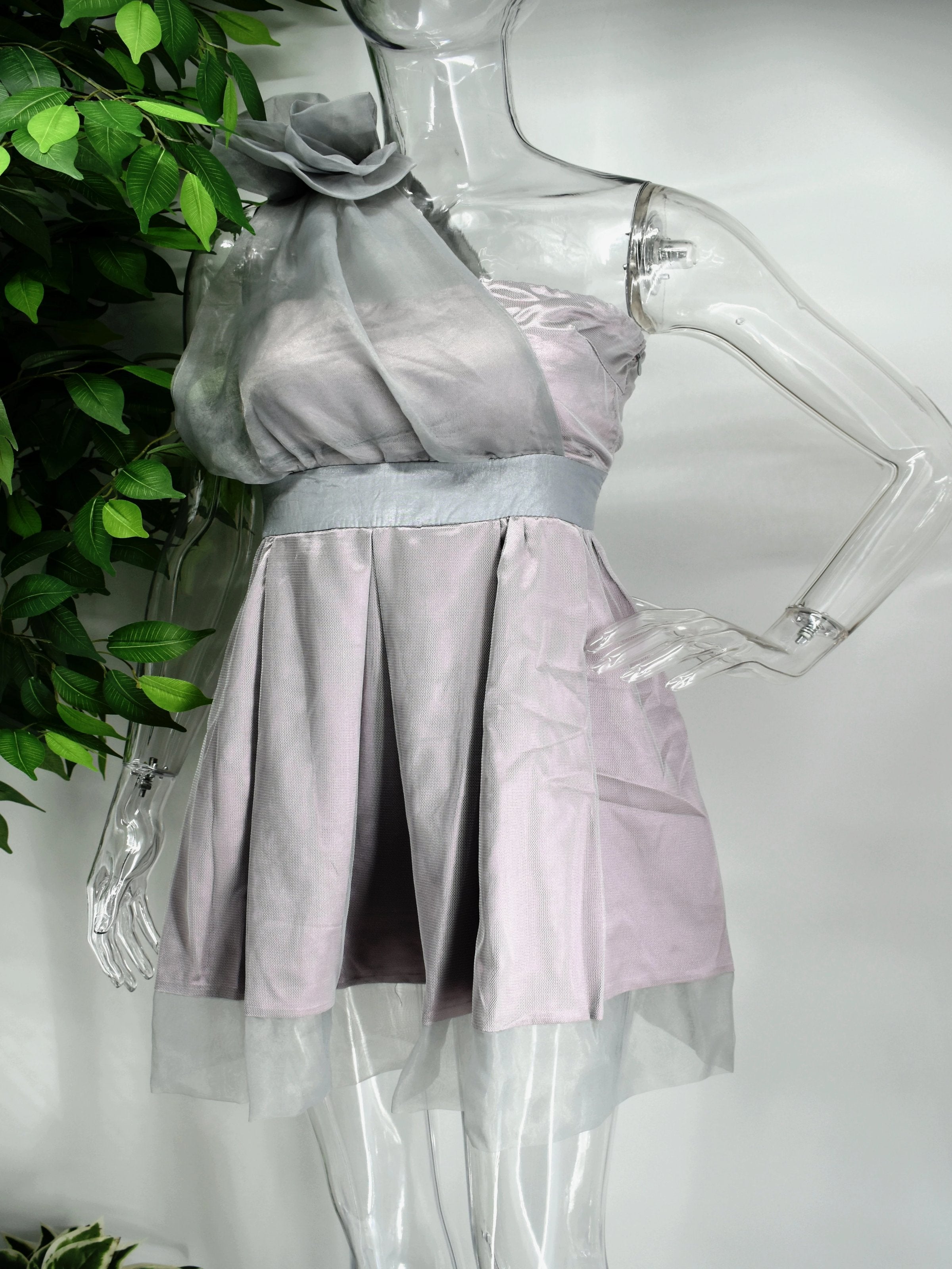 Be the bell of the ball in our Bella fit and flare dress. This strapless  purple and gray dress is an easy crowd pleaser with its cinched waist and flare bottom. The strapless top is accompanied by a sheer sash.
