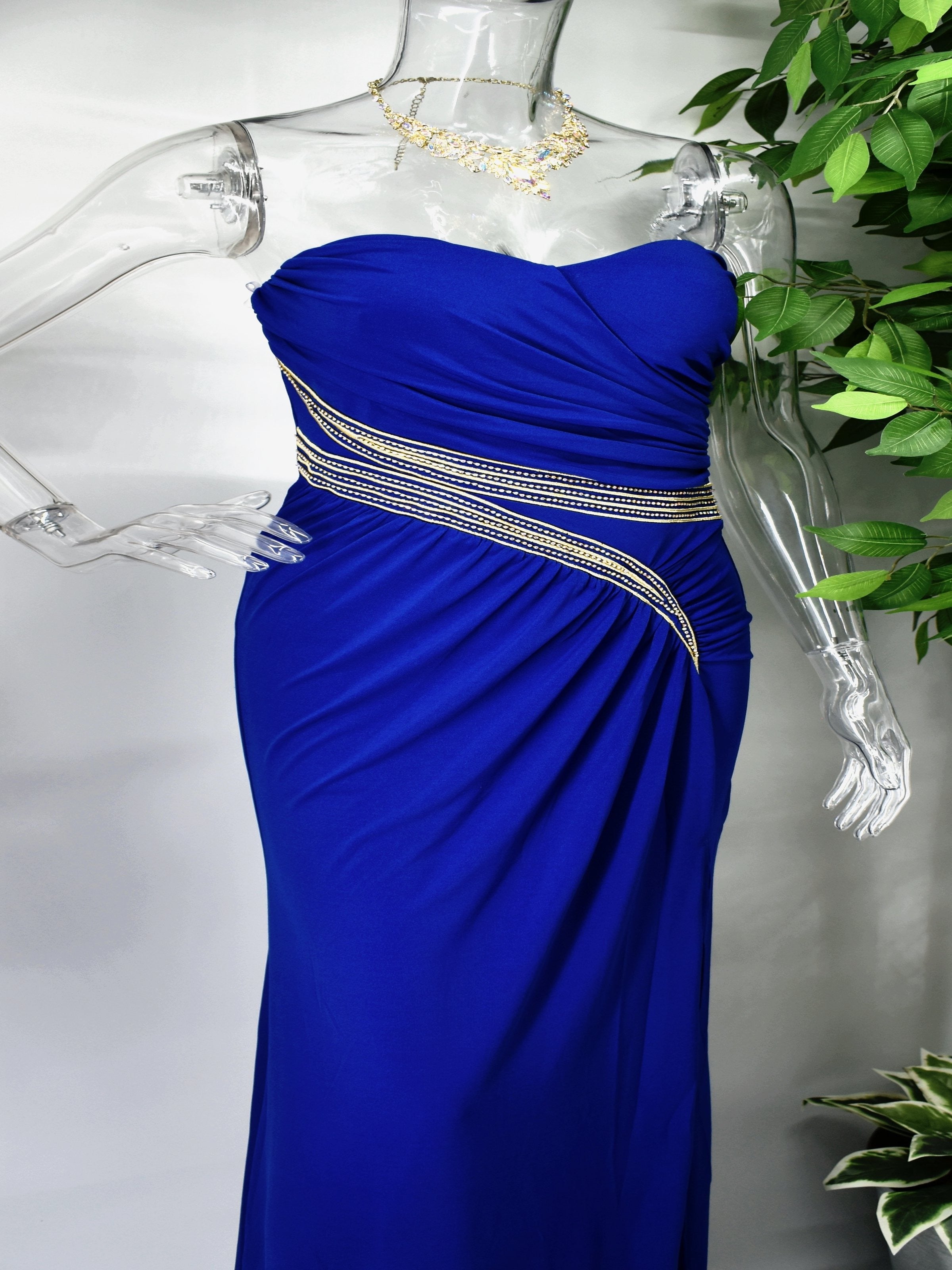 Be the bell of the ball in our Belle formal blue dress. Belle is a stunning long blue dress with gold stitch and stone embellishment. This dress is perfectly paired with a semi sweetheart neckline at the top and a small side opening at the hem.