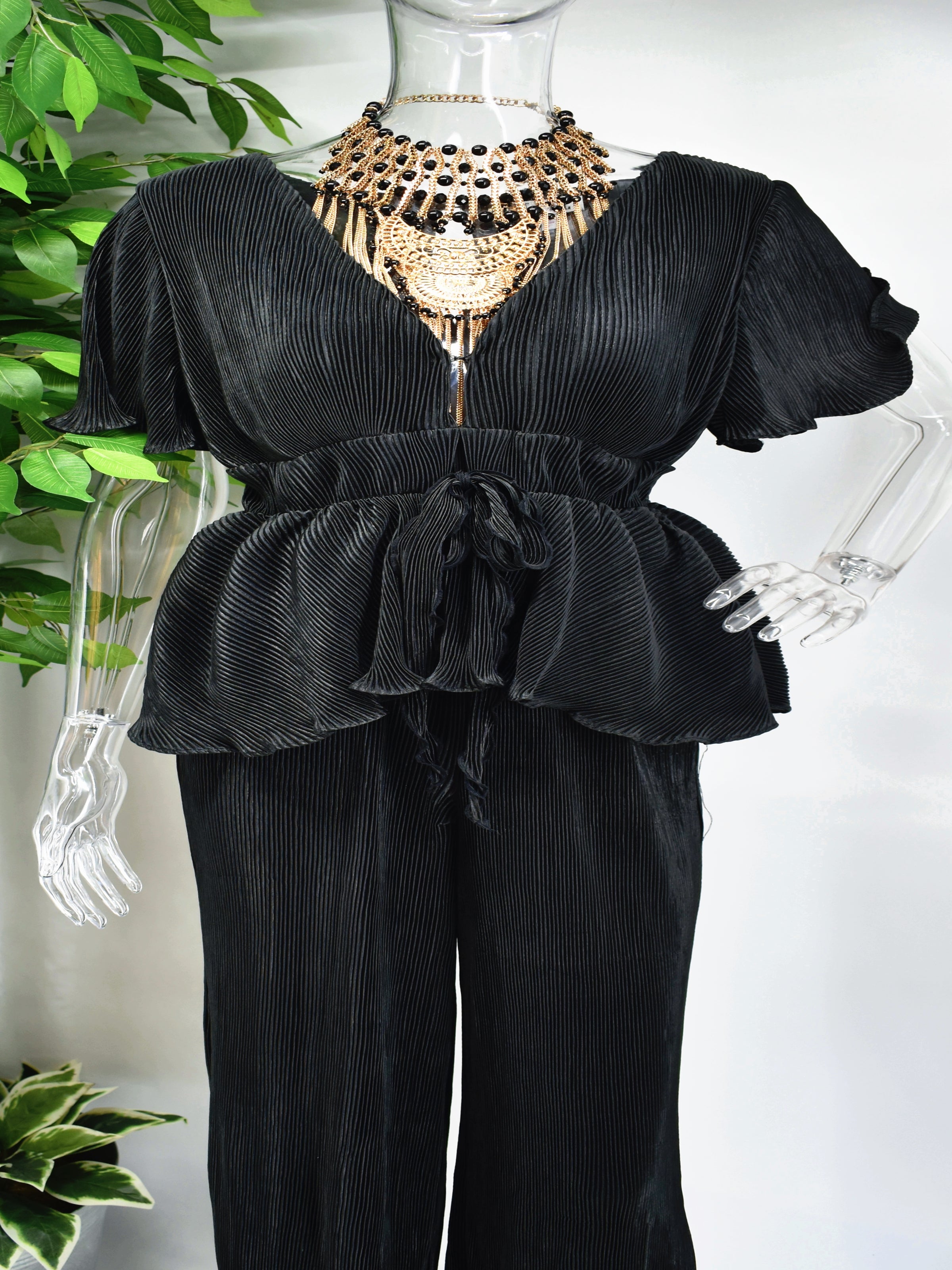 Give a nod to your impeccable taste while you slip on our sensational Bianka Jumpsuit. Our Black Bianka Pants Jumpsuit has a v neckline and short sleeves. The peplum bodice can become as cinched as you would like it with its tied waist. 