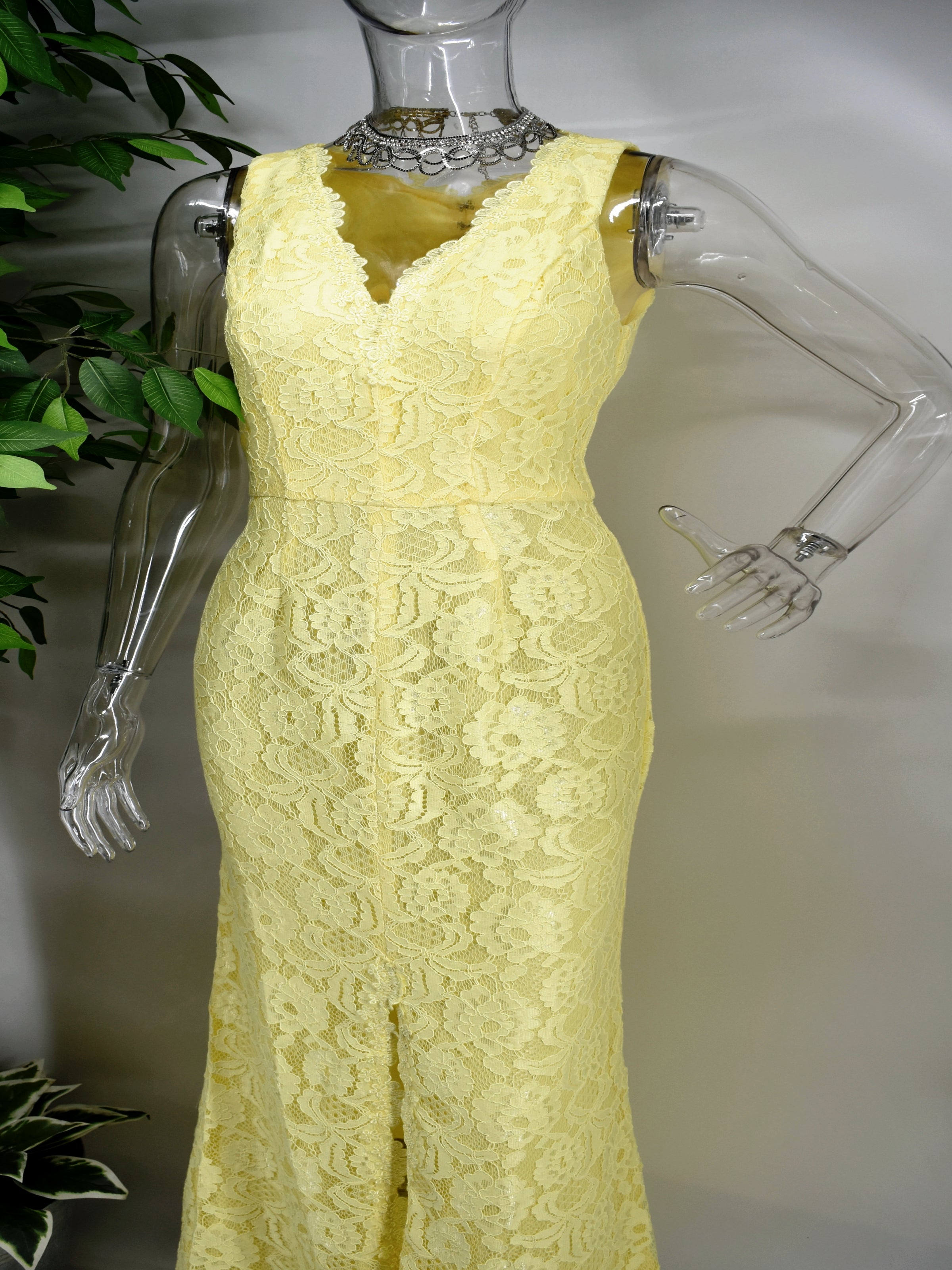 Always be on the minds of others in our Bonnell lace dress. Our Bonnell is a V-neck sleeveless yellow long dress adorned with lace and accented with a center slit that rises a little above the knee.