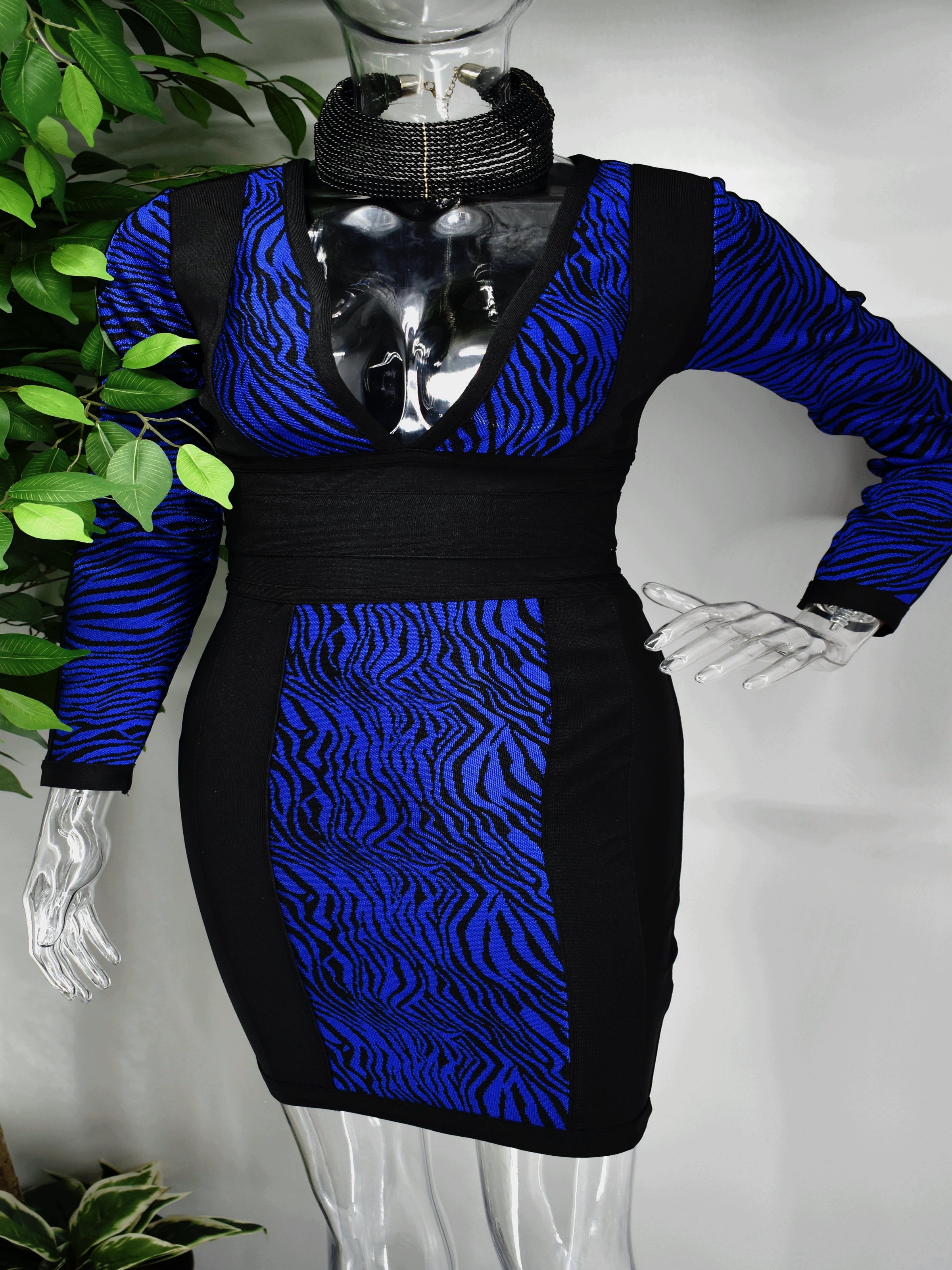 Our Bridgette Bandage dress brings that exotic vibe and is perfect for a night out. The bold blue and black tiger print centers this beauty which has a fitted bodice, long sleeves, and a plunging v-neck line. It is supported by a cinched waist and a fitted skirt which lands above the knee. 