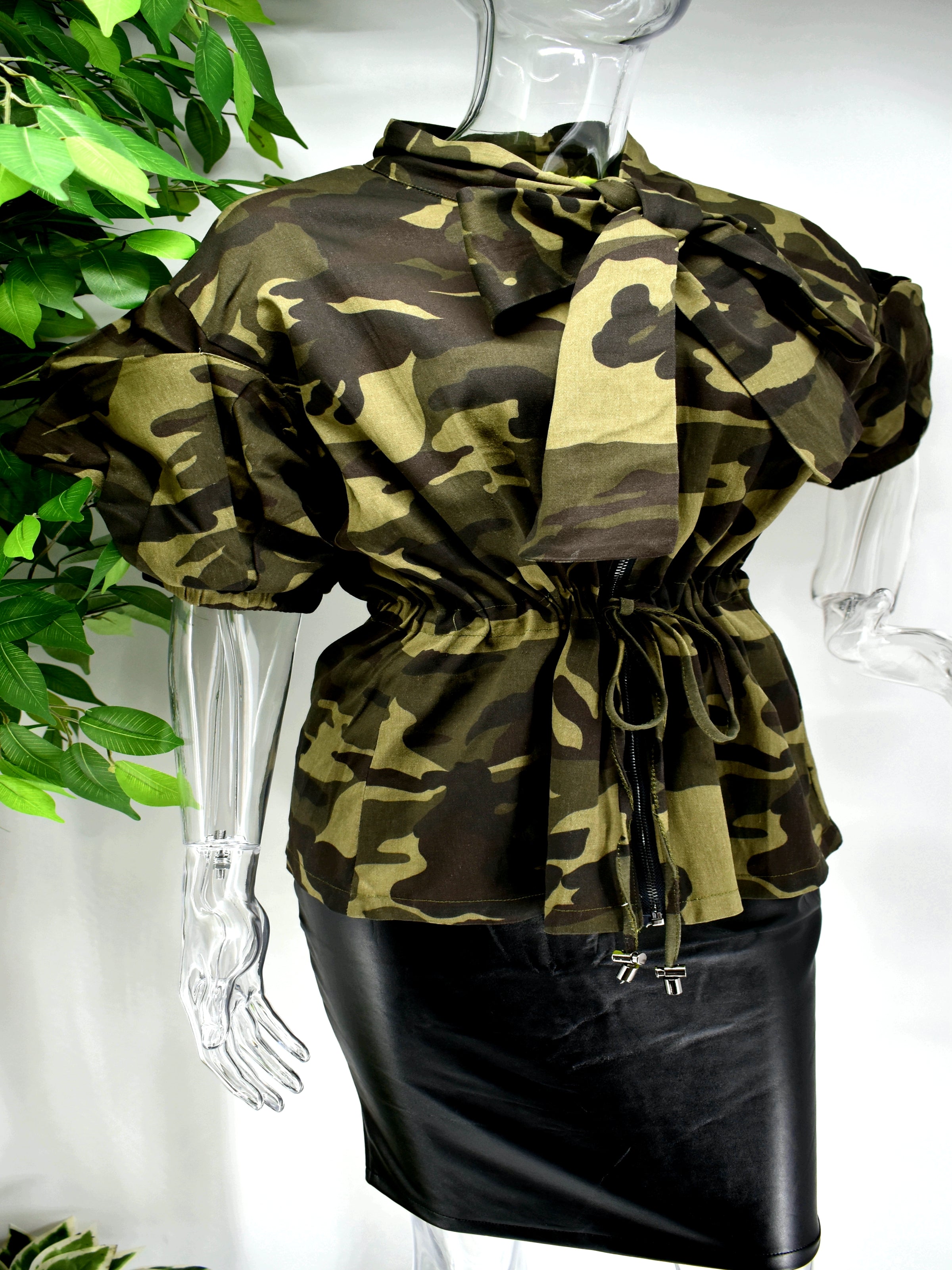 Different and irreplaceable is the words you would use to describe our Burma  camouflage top. Our Burma camo top is so unique. It has a cinched draw string waist and a unique puffed sleeve to add some drama to this classic color staple. 
