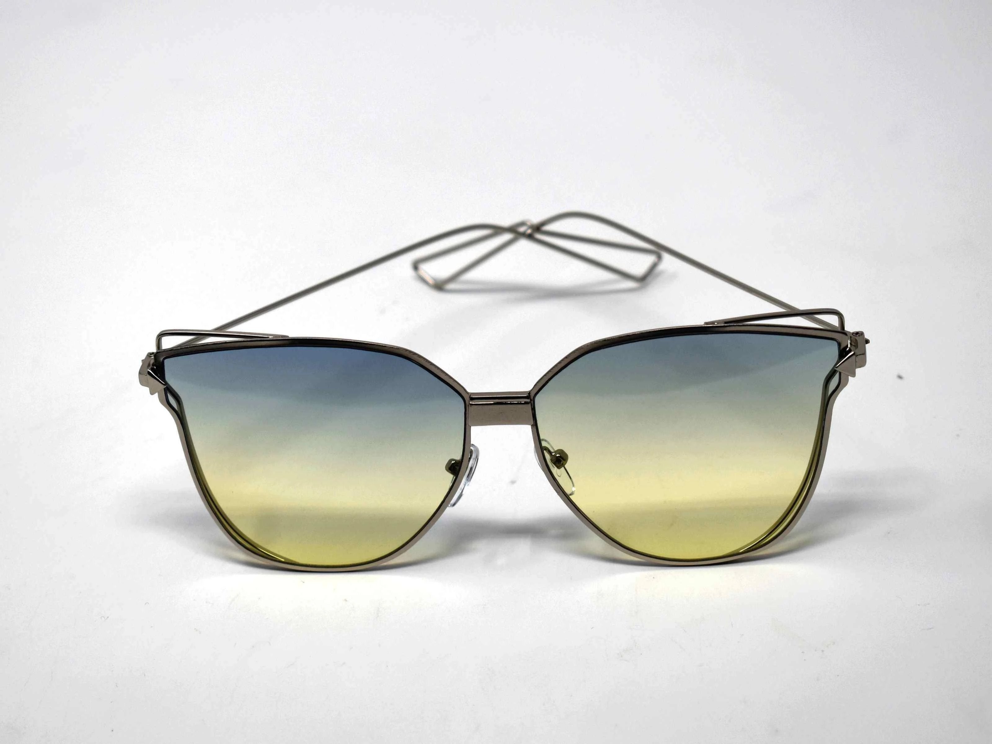 A certified stunner is what they will call you in our Camellia silver butterfly framed glasses with green ombre lens.