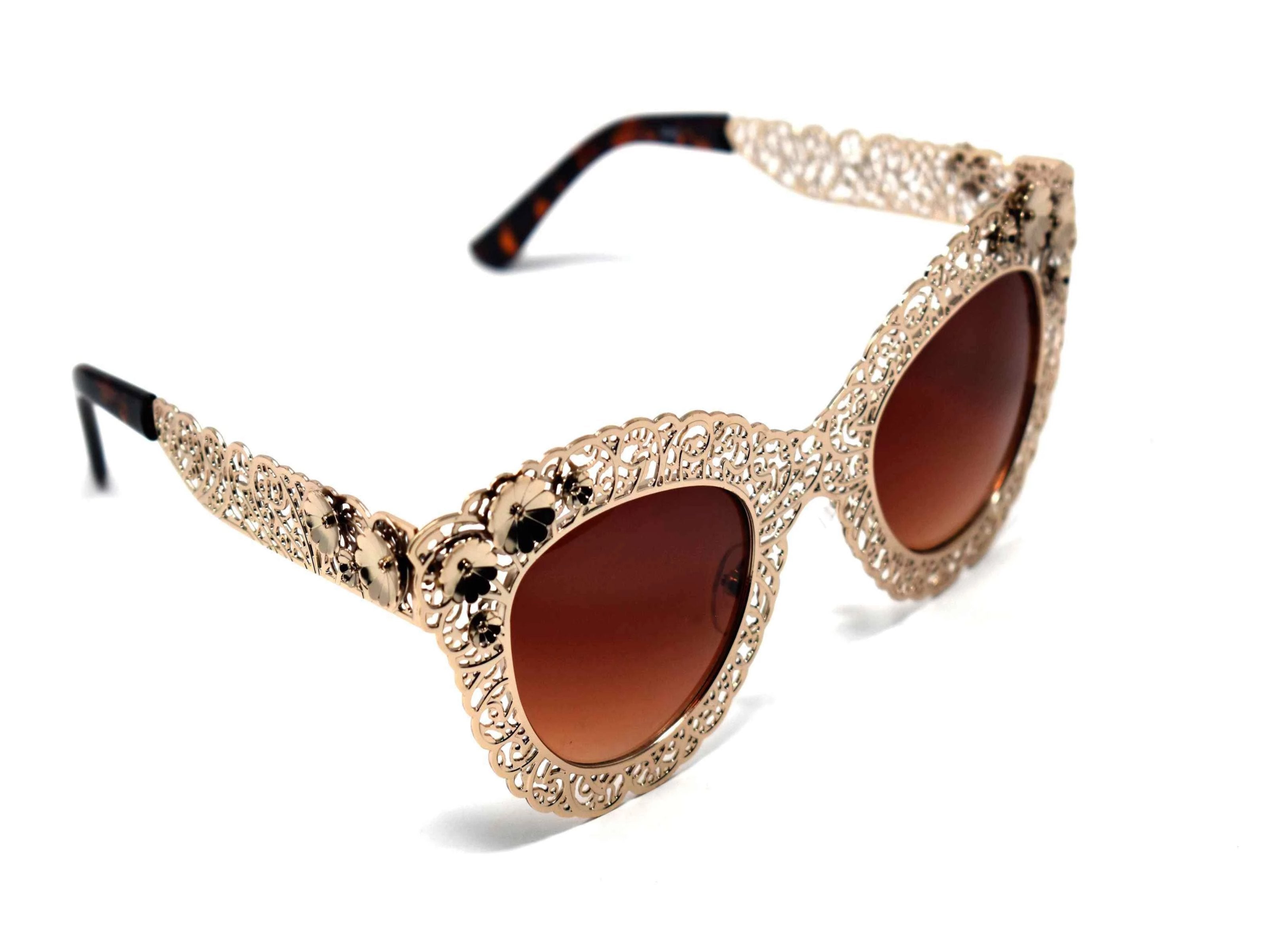 Both dainty and daring be bold in our Cardinal rose gold metal frame sunglasses with brown lens.