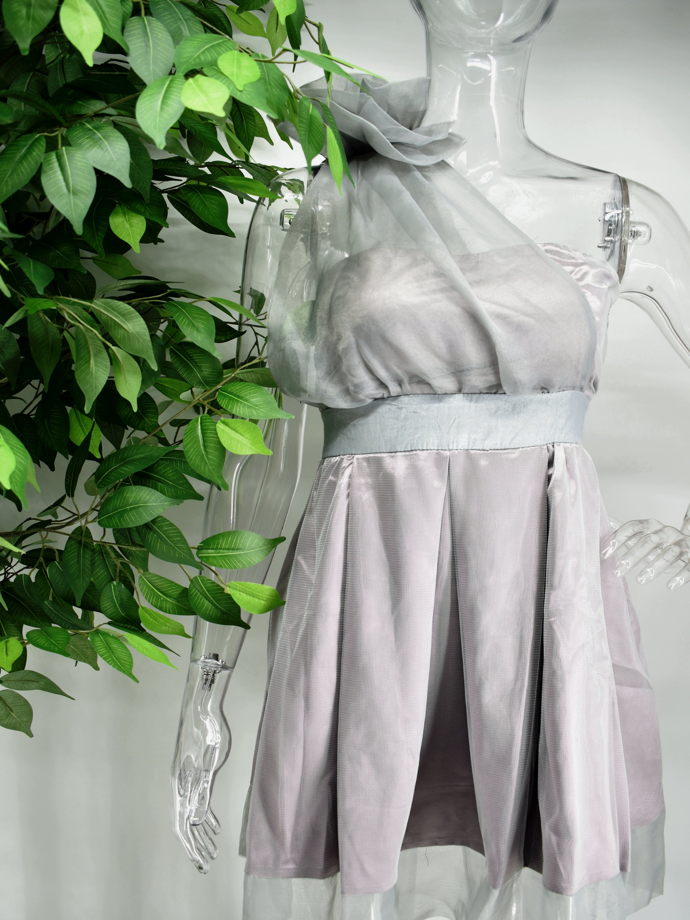 Be the bell of the ball in our Bella fit and flare dress. This strapless  purple and gray dress is an easy crowd pleaser with its cinched waist and flare bottom. The strapless top is accompanied by a sheer sash.