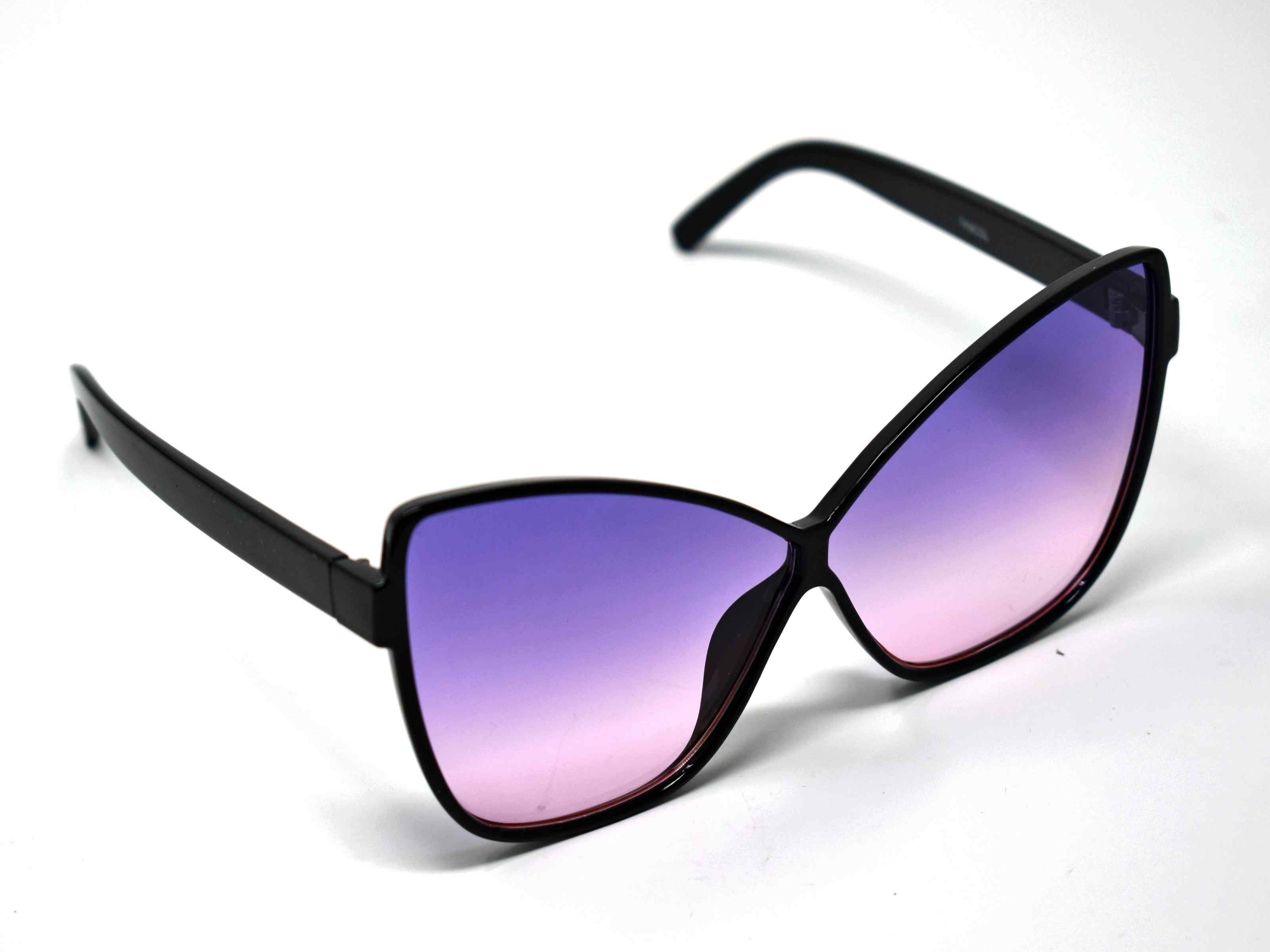Our dahlia black cat eye frame with a purple to pink ombre lens should be considered a no brainer when adding a touch of eye catching style.