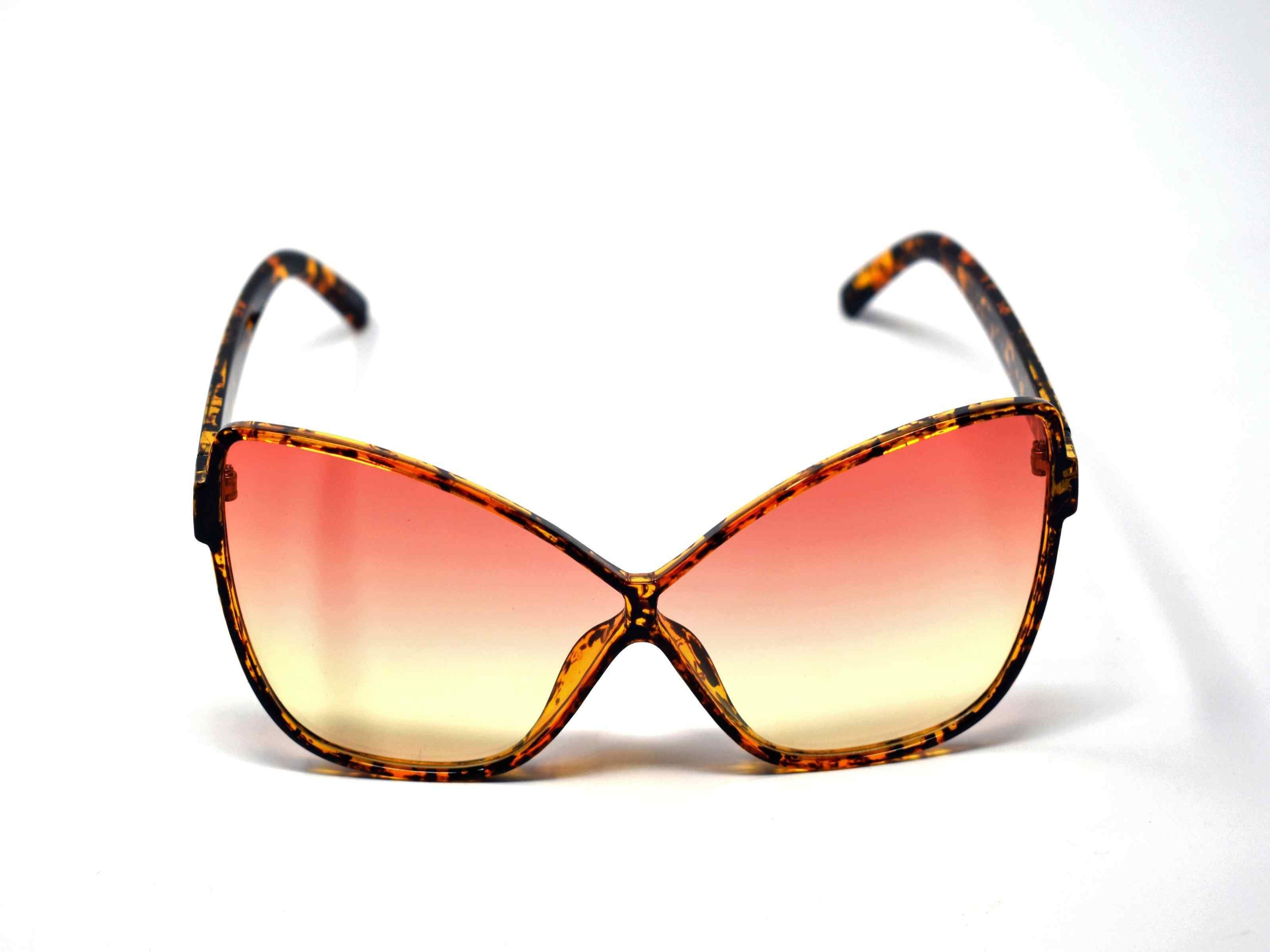 Our dahlia leopard tortoise cat eye frame with a orange to yellow ombre lens should be considered a no brainer when adding a touch of eye catching style.