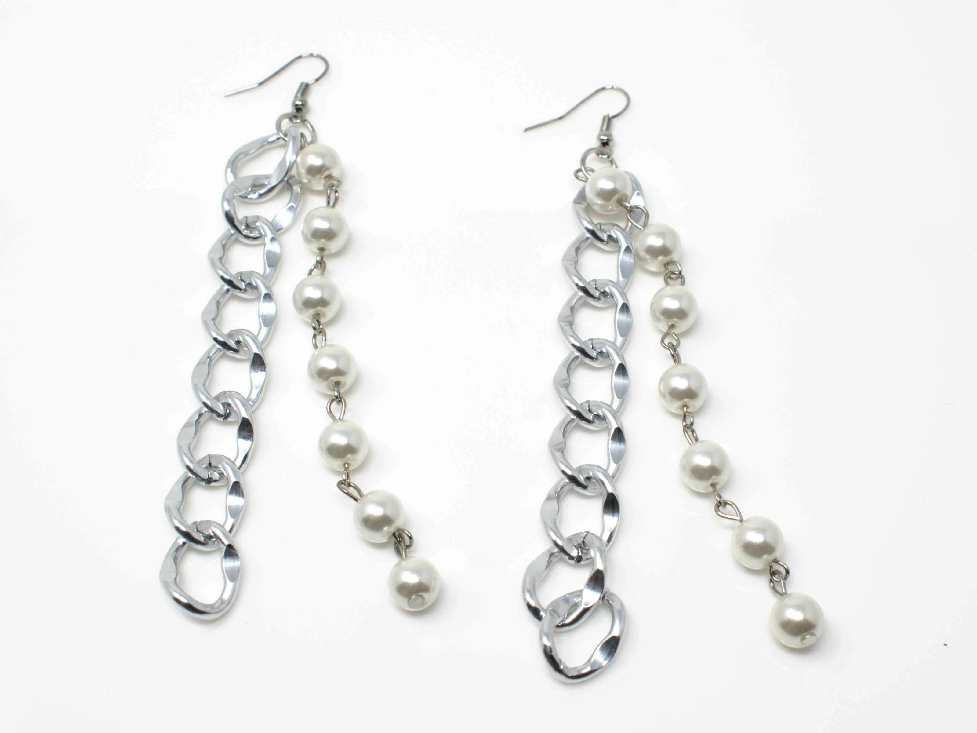 An elegant silver drop dangle earring with pearl accents and a fish hook clasp.