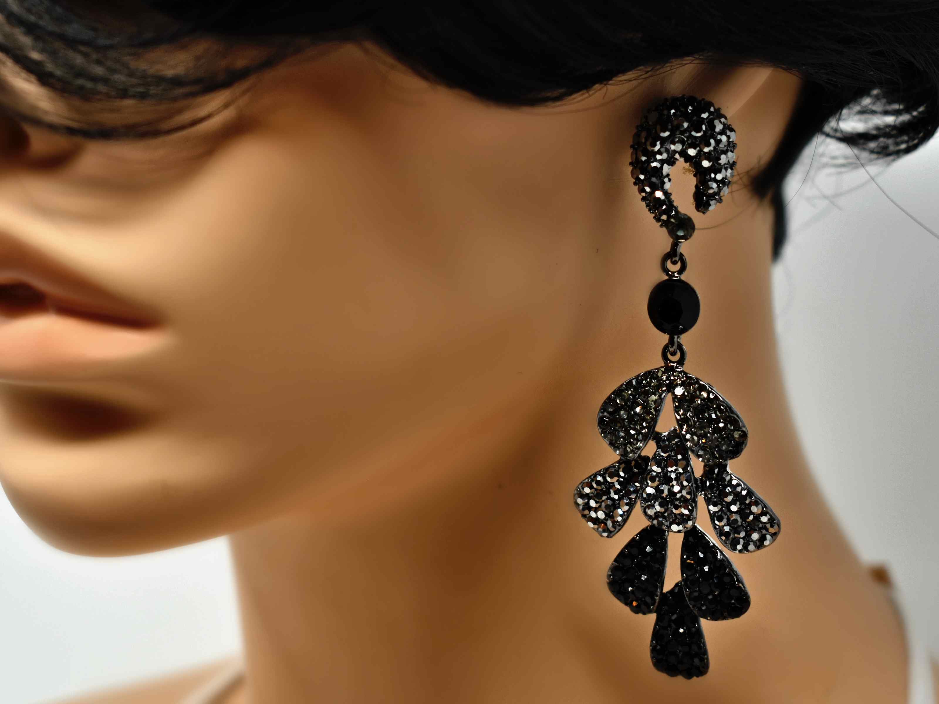 Our Erica Pewter dark silver earrings is designed to stand out from the crowd. These statement drop earrings are three tiered design accented with grey pewter and black stones. It is 3 1/2 inches in length with a push back clasp.