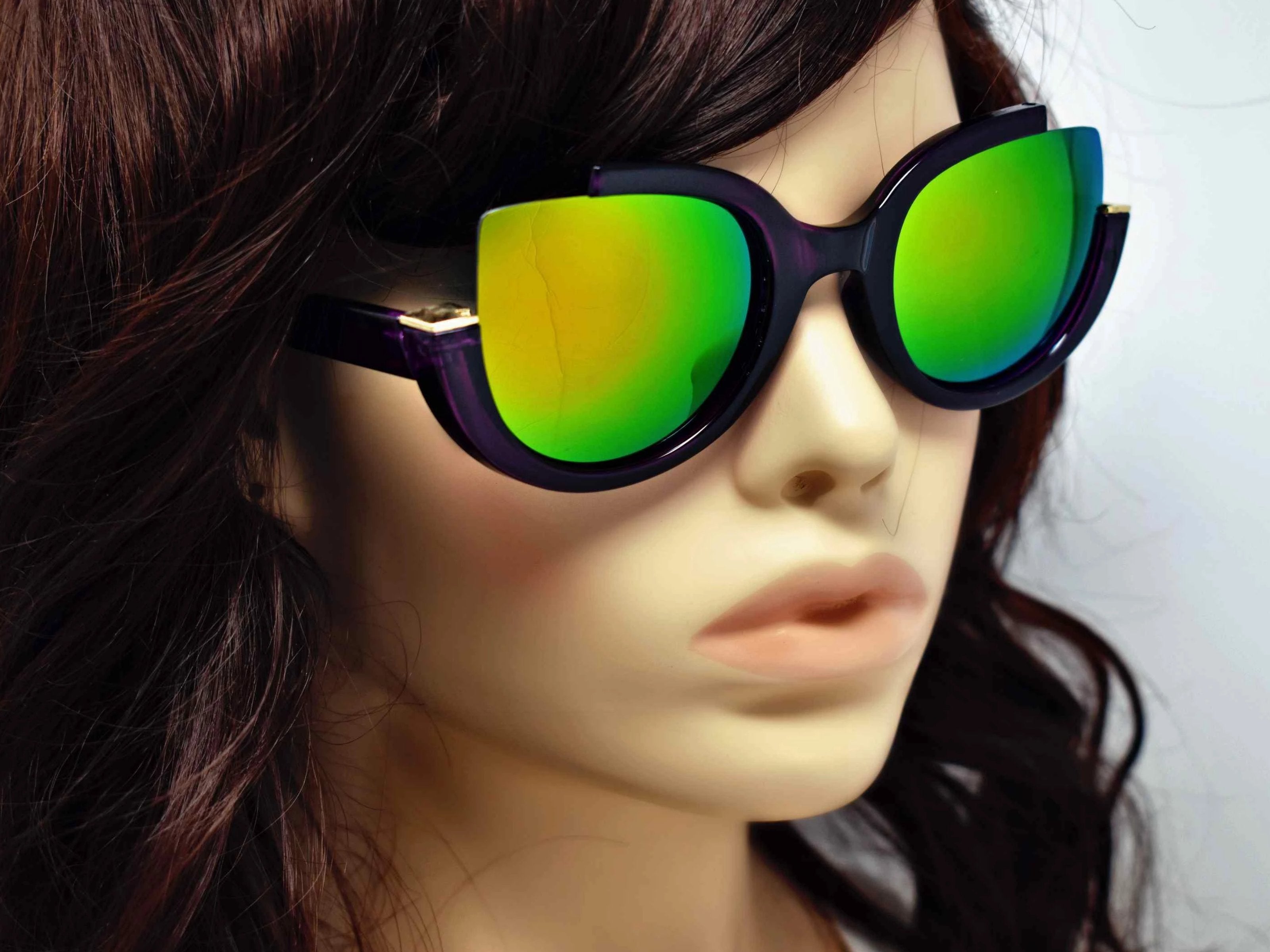 Stunning and stylish is the best way to describe our Larkspur purple cut out frame  with a two-toned green mirrored lens sunglasses.