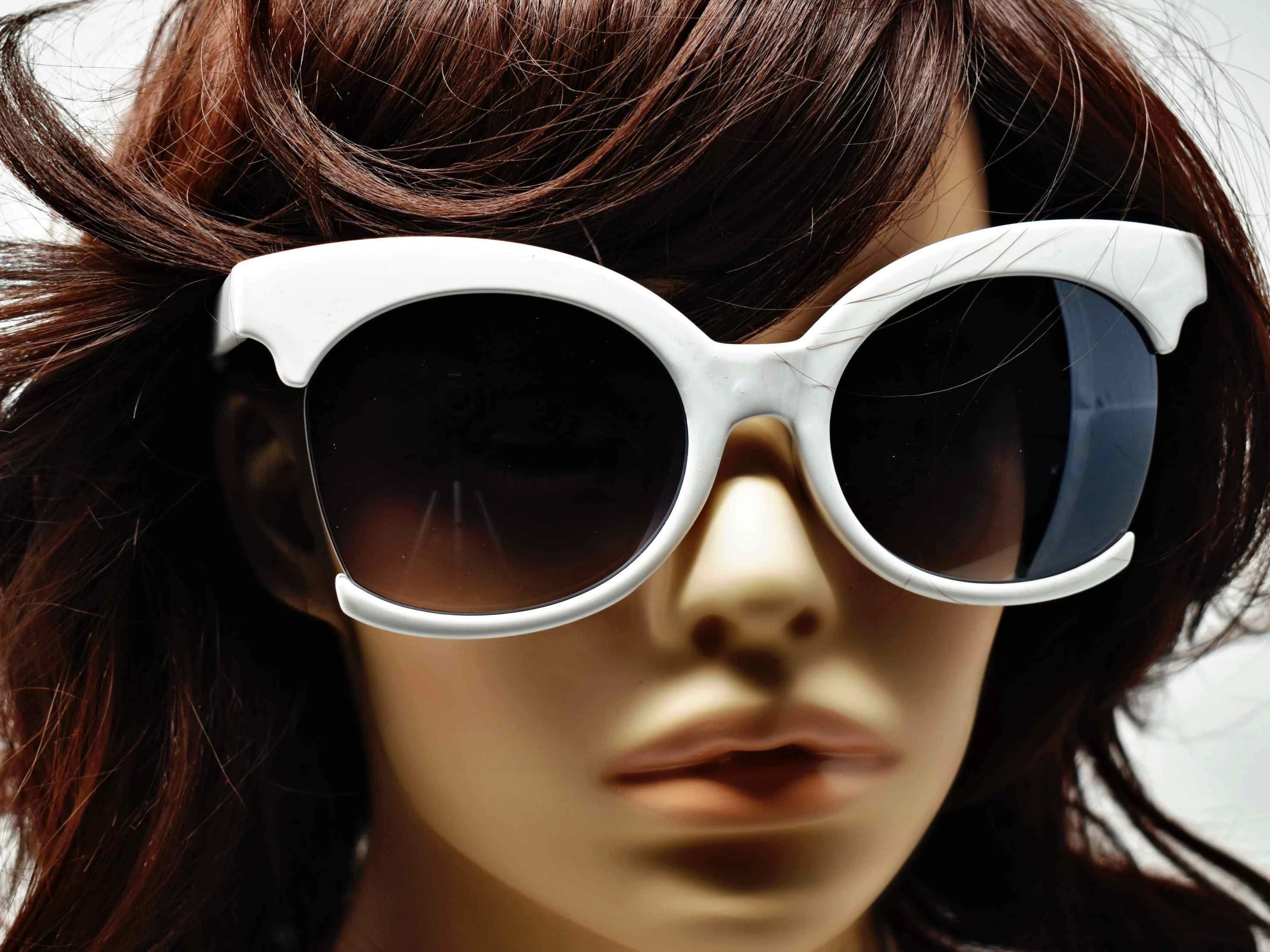Be bold in our cutting edge primrose white cut out frames with a black lens. 