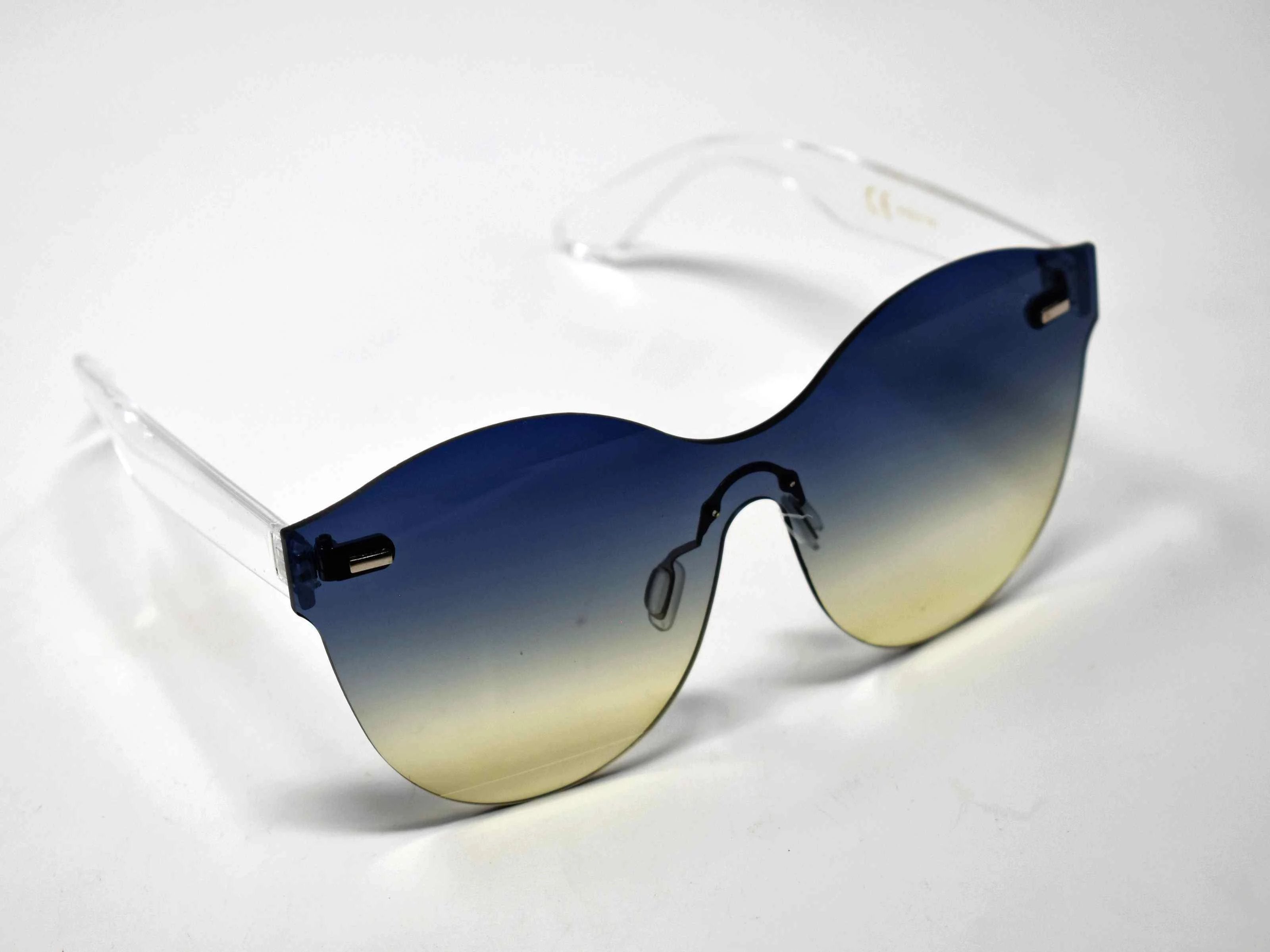 Its just a good vibe in these sage no rim sunglass frames with a blue to cream ombre lens.