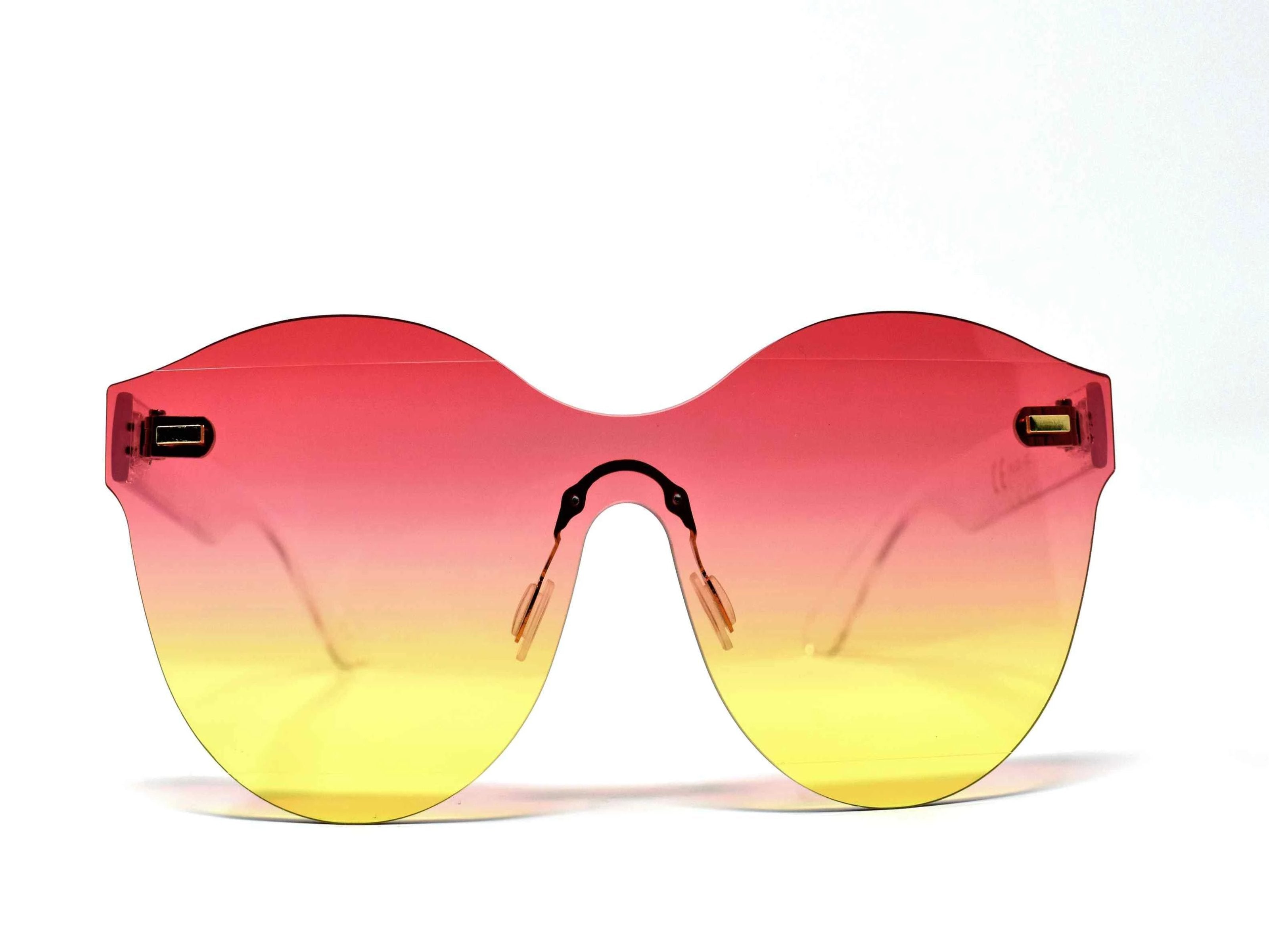 Its just a good vibe in these sage no rim sunglass frames with a rose pink to yellow ombre lens.
