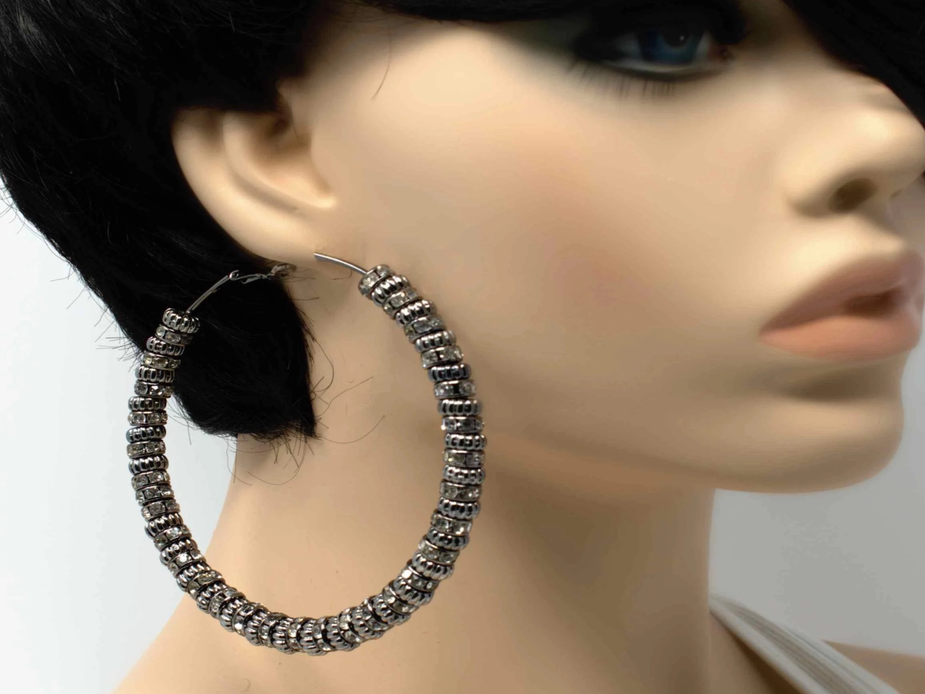 A fabolous silver hoop multi charmed earring crafted to stand out in your collection.