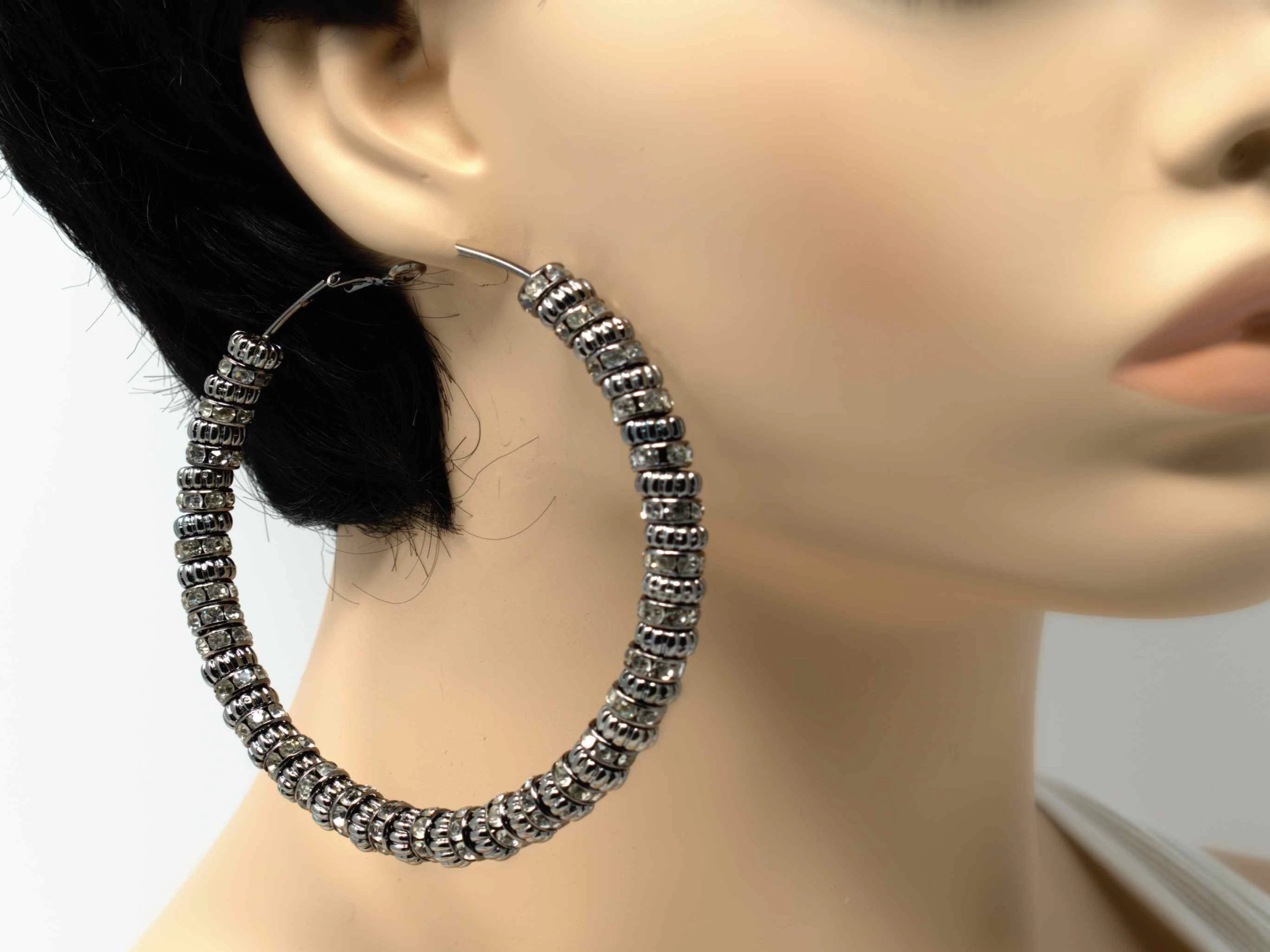 A fabolous silver hoop multi charmed earring crafted to stand out in your collection.