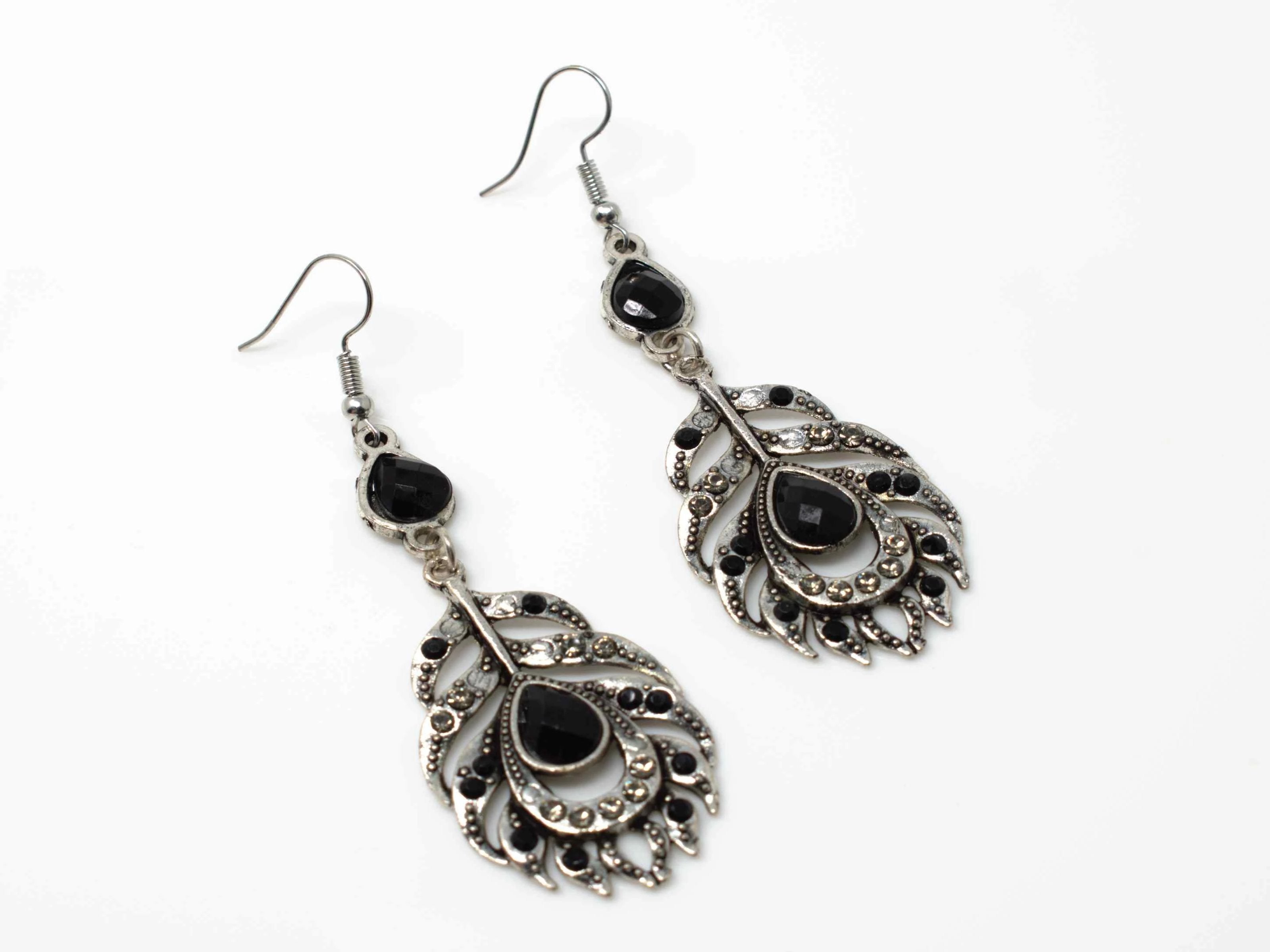 A dainty silver drop dangle feather fashion earring with black accent stones and a fish hook clasp.